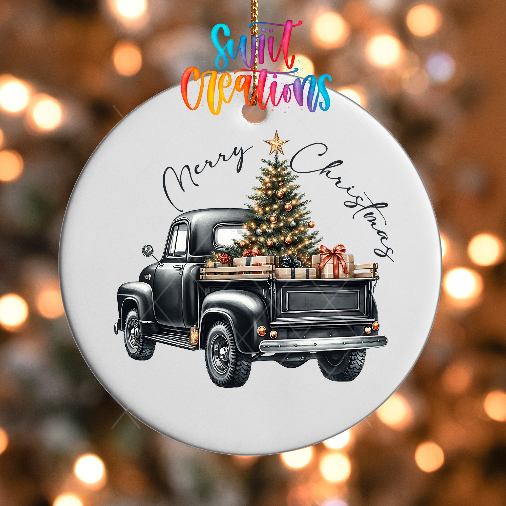 A white ornament with a black vintage truck carrying a Christmas tree and presents.