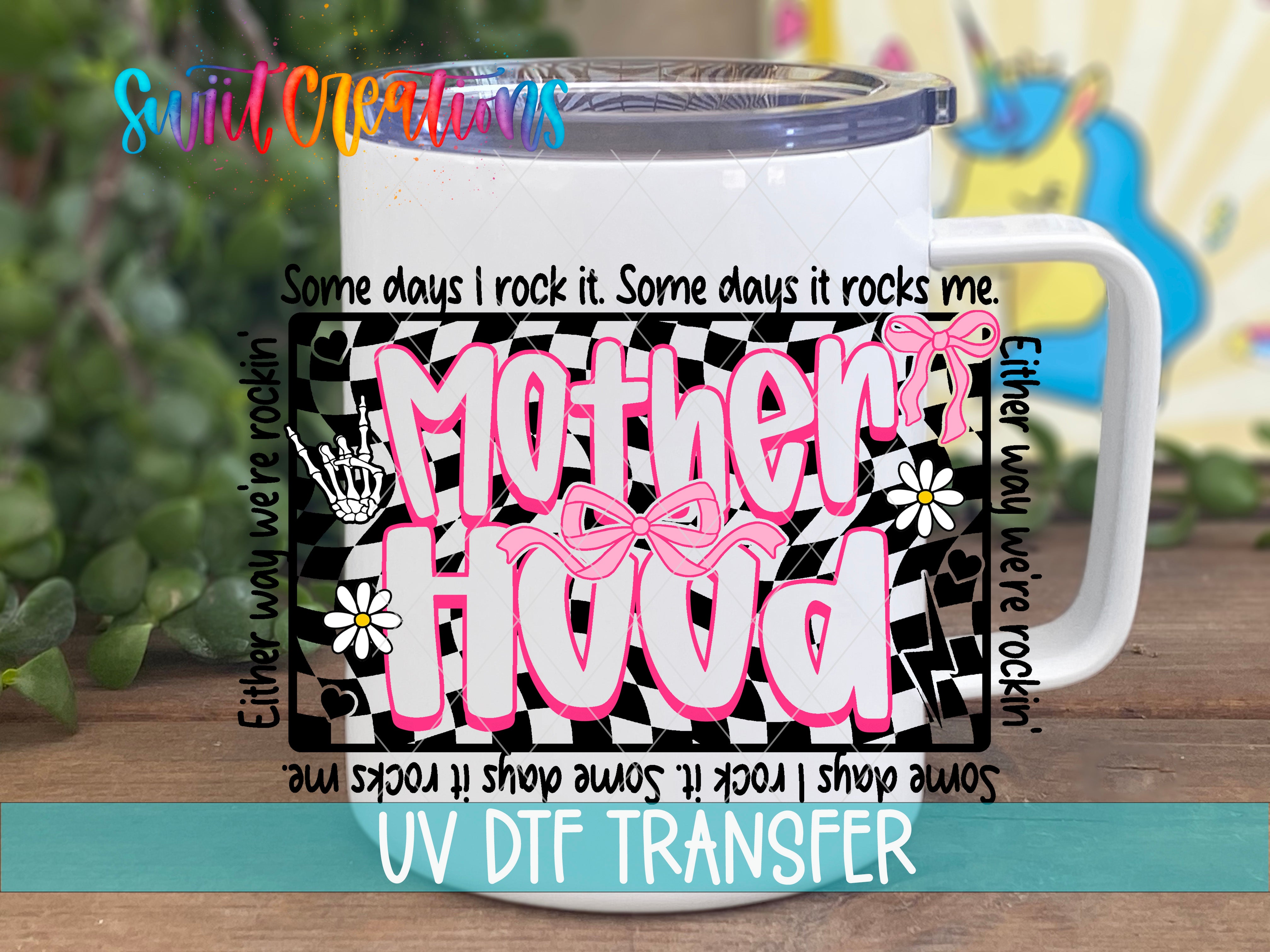 A white mug with a colorful design and text printed on it, placed on a wooden surface.