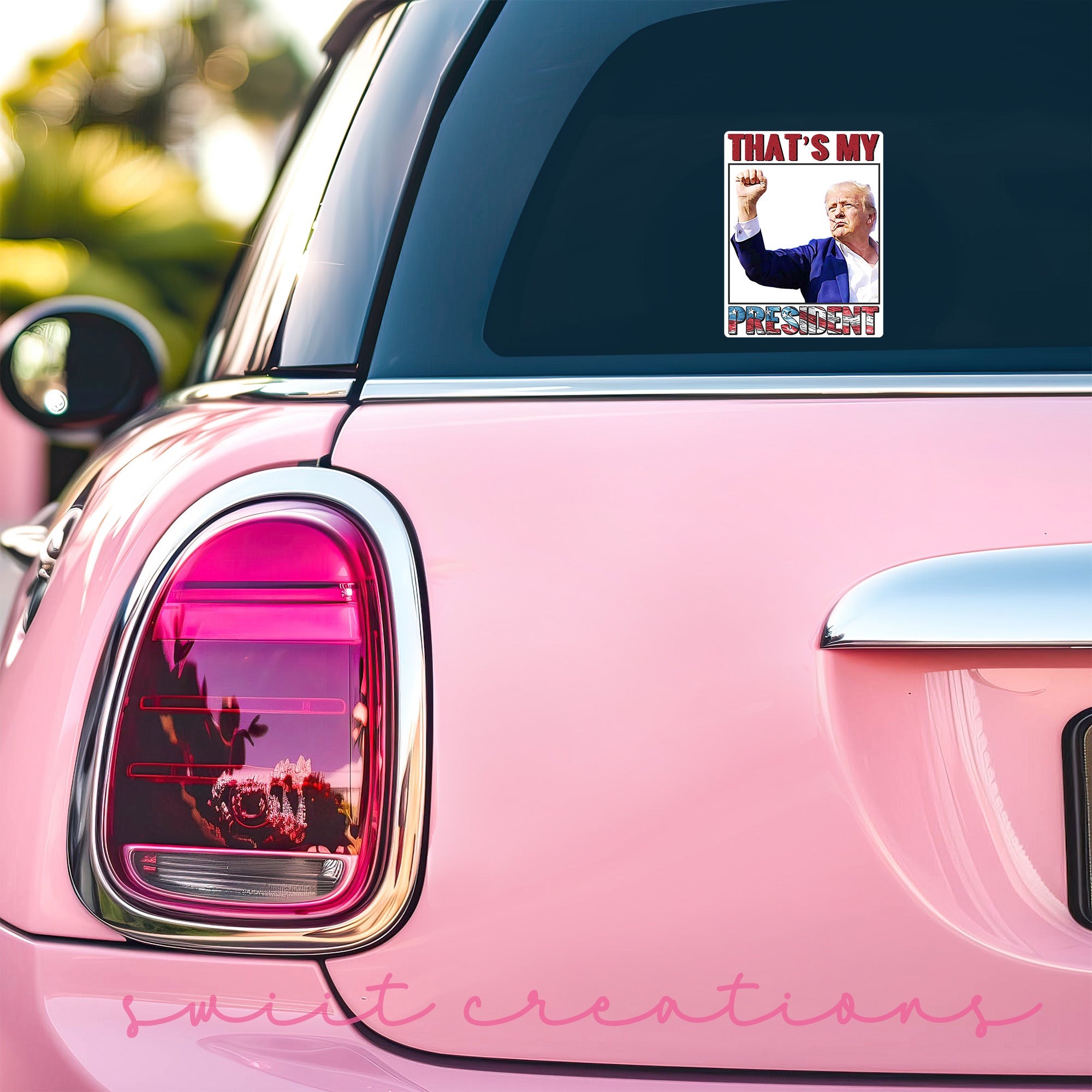 a pink car with a pink sticker on it