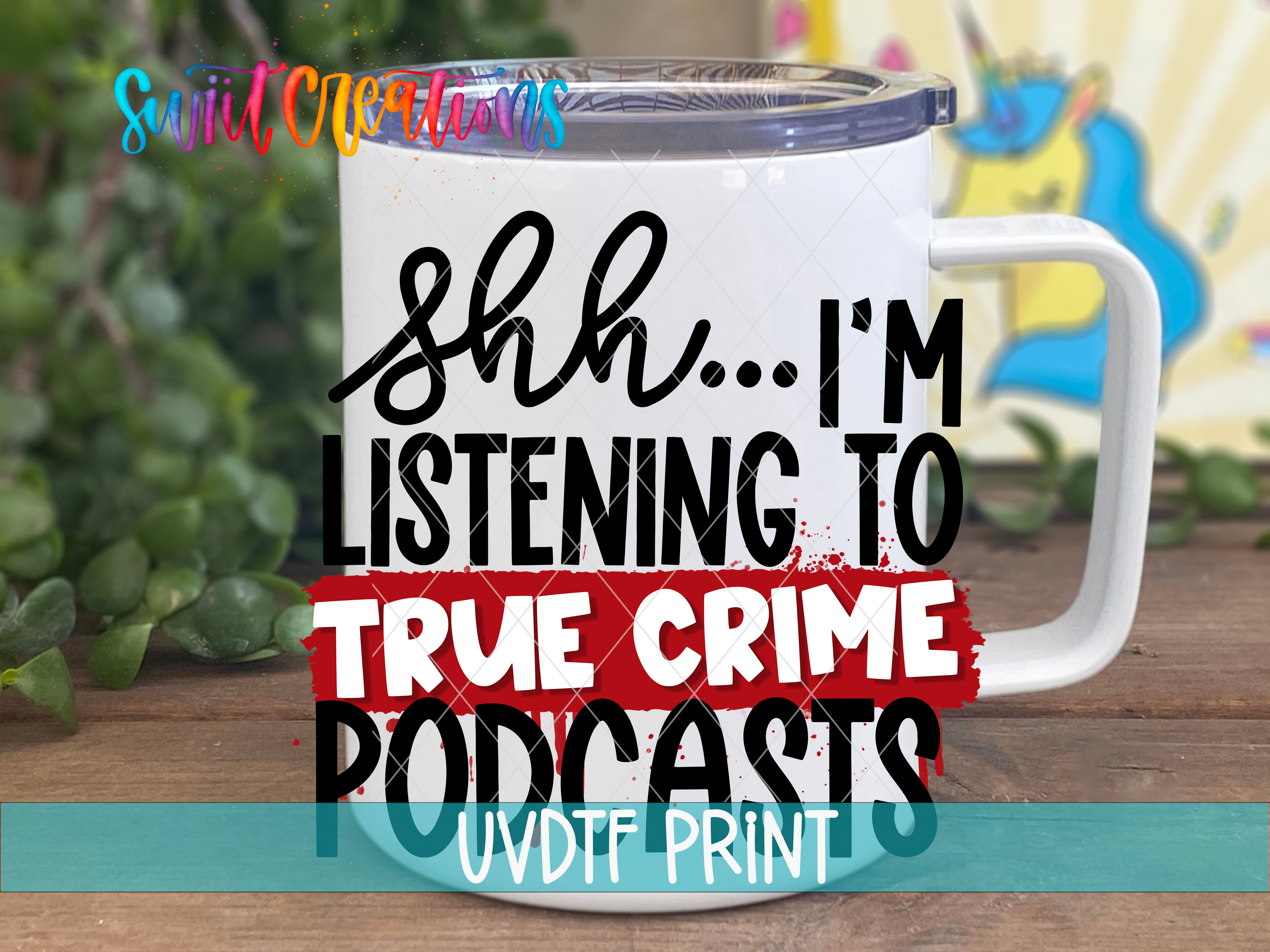 A white mug with text printed on it, placed on a wooden surface.