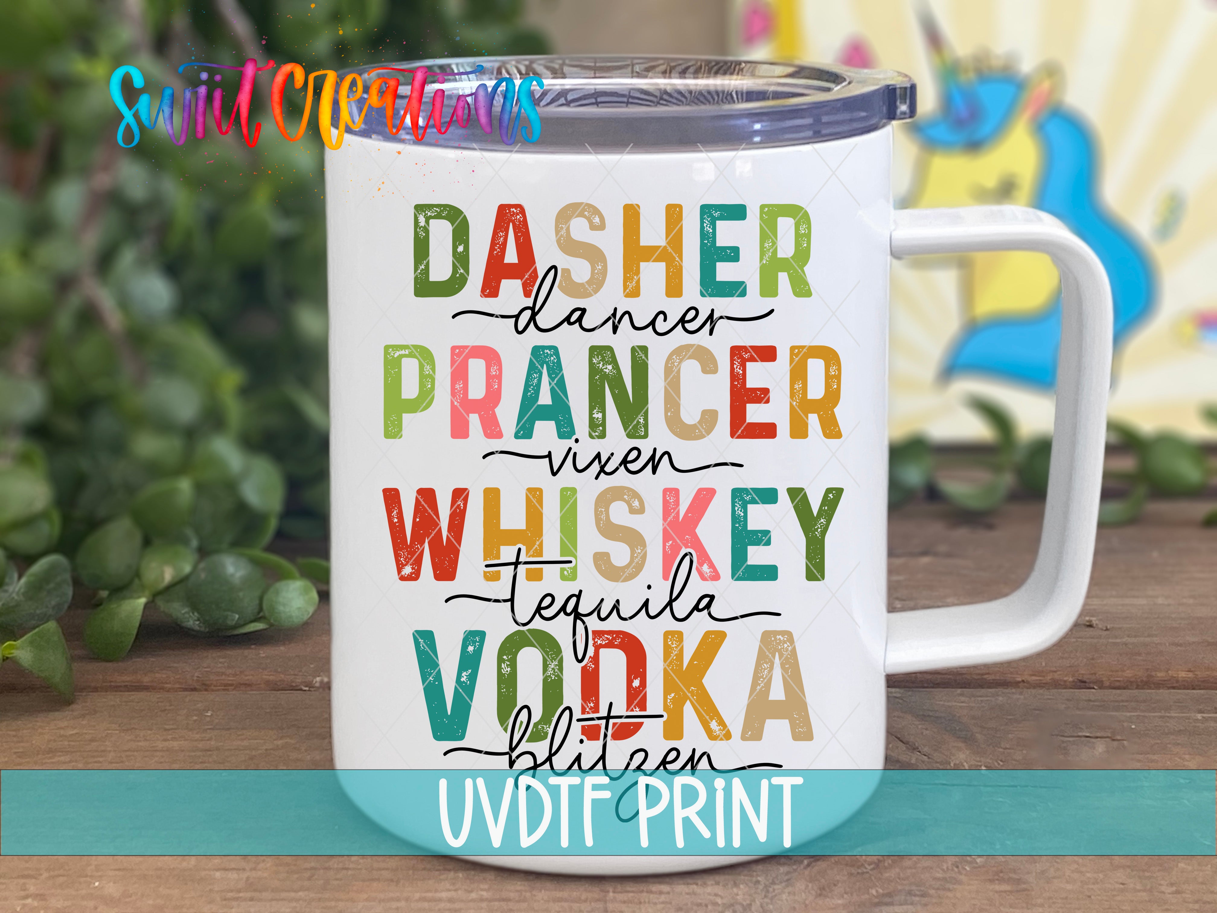 A white mug with colorful text printed on it, placed on a wooden surface.