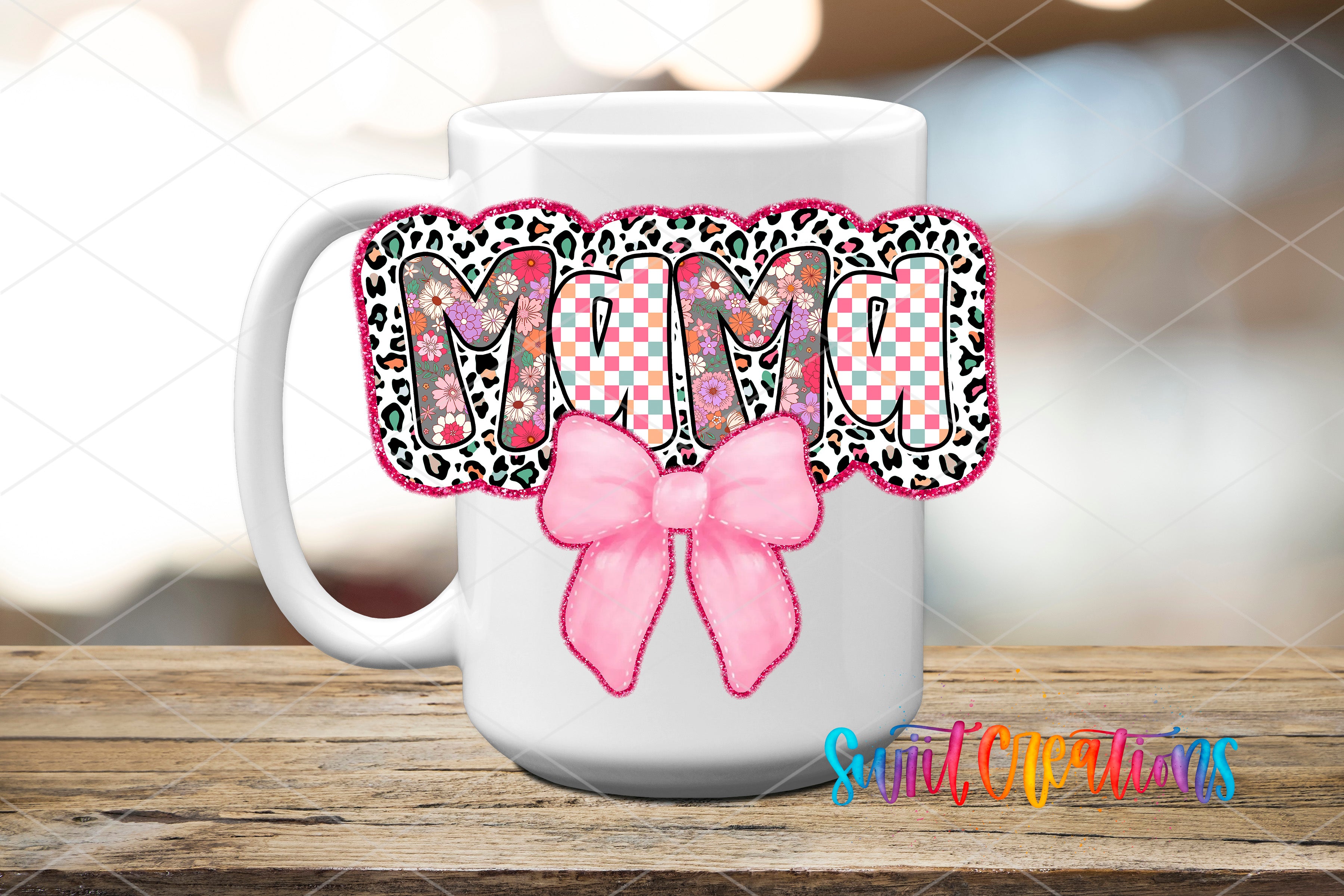 A white ceramic mug with a decorative design featuring the word "MUMO" in a checkered pattern and a pink bow.