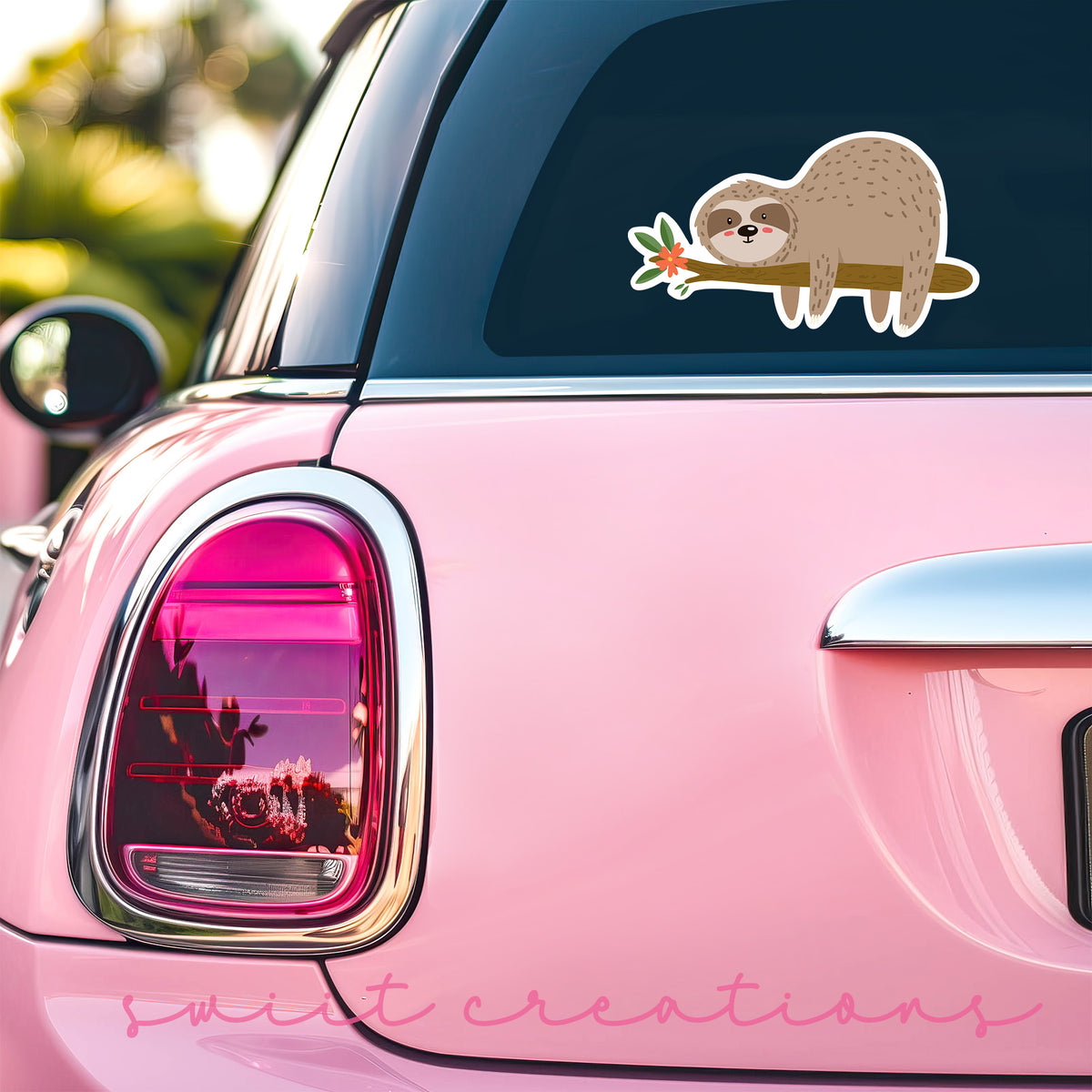 a pink car with a sticker of a slotty on it