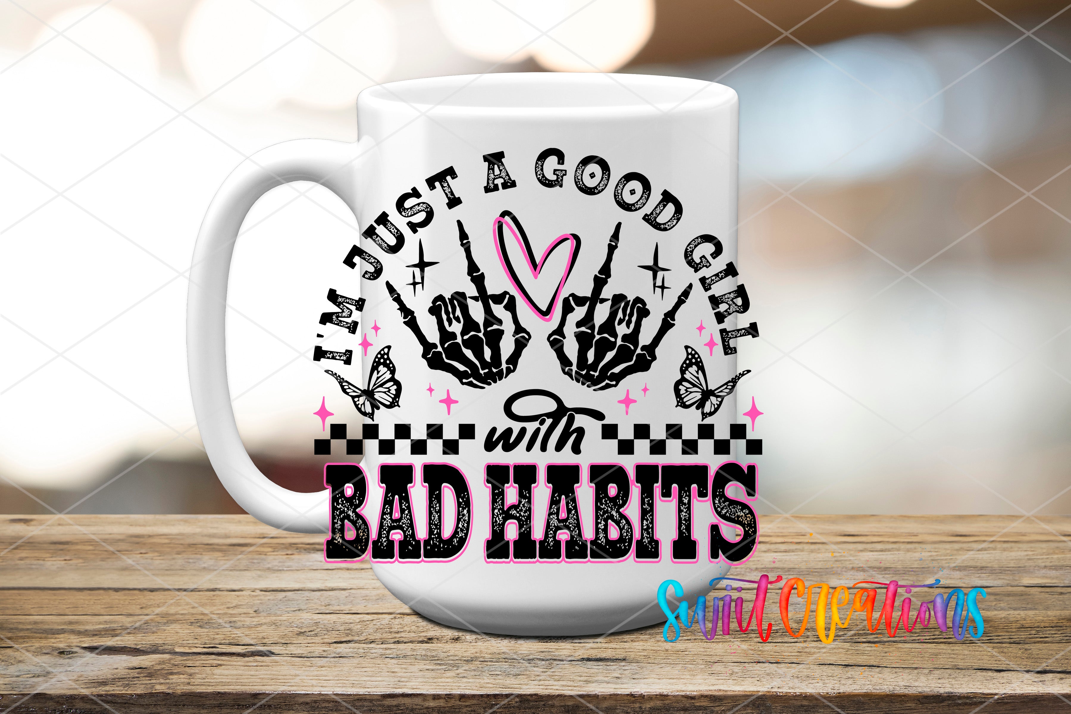 A white ceramic mug with a graphic design featuring a skeleton hand and the text "I'm just a good girl with bad habits" printed on it.