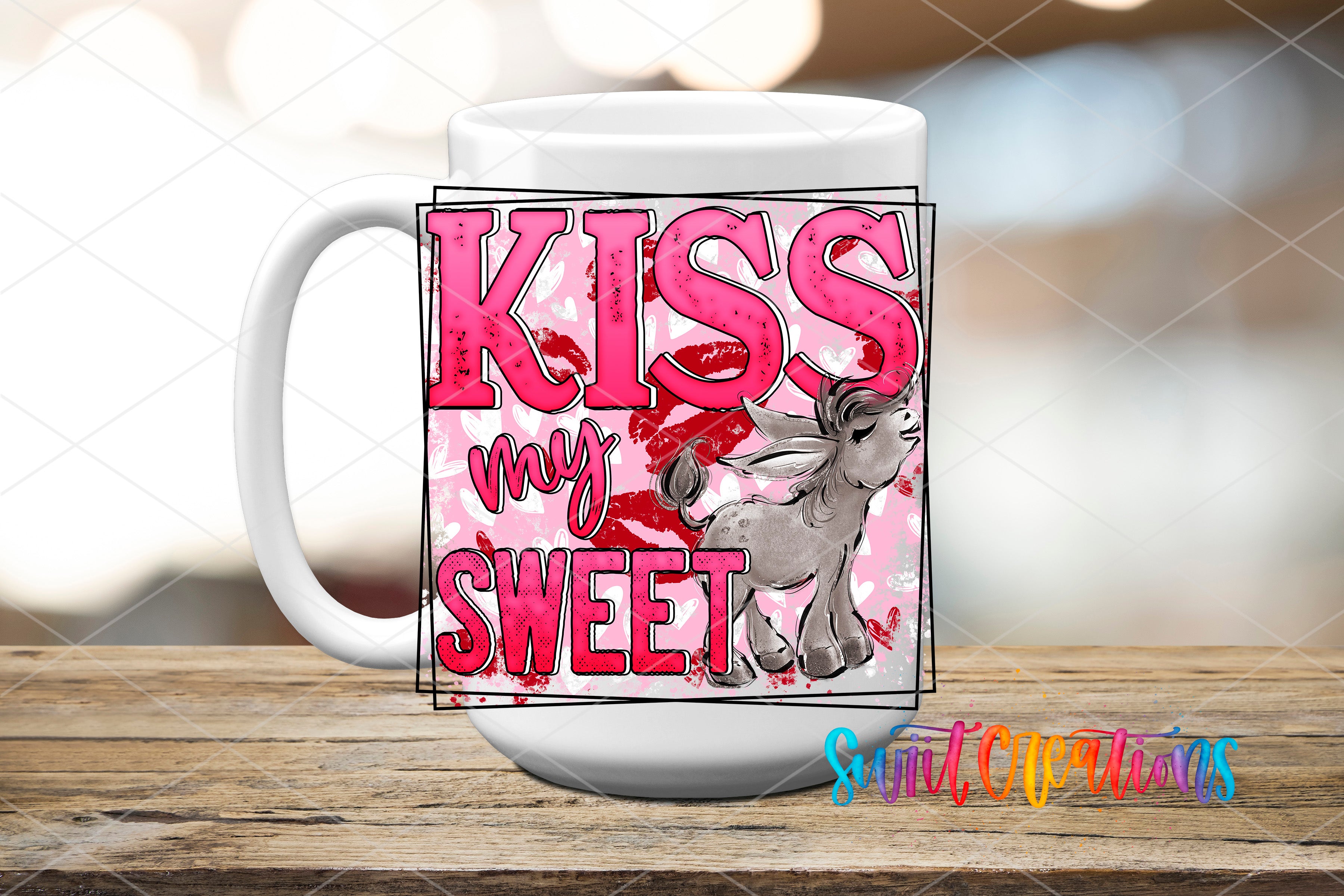 A white mug with a pink and red design featuring the text "KISS MY SWEET" and an illustration of a kissing animal.