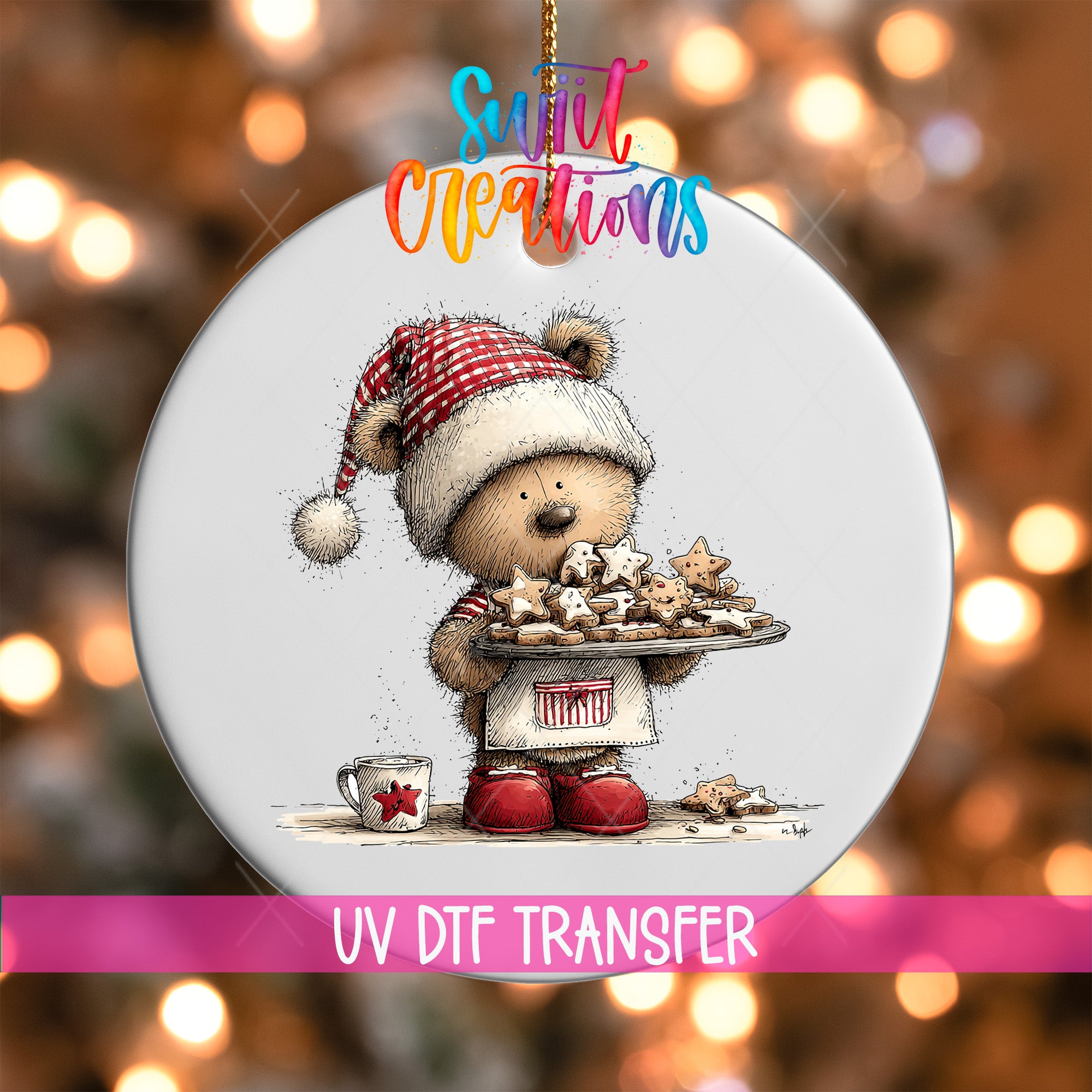 A round ornament featuring a teddy bear wearing a Santa hat and holding a tray of cookies, with a background of colorful lights.