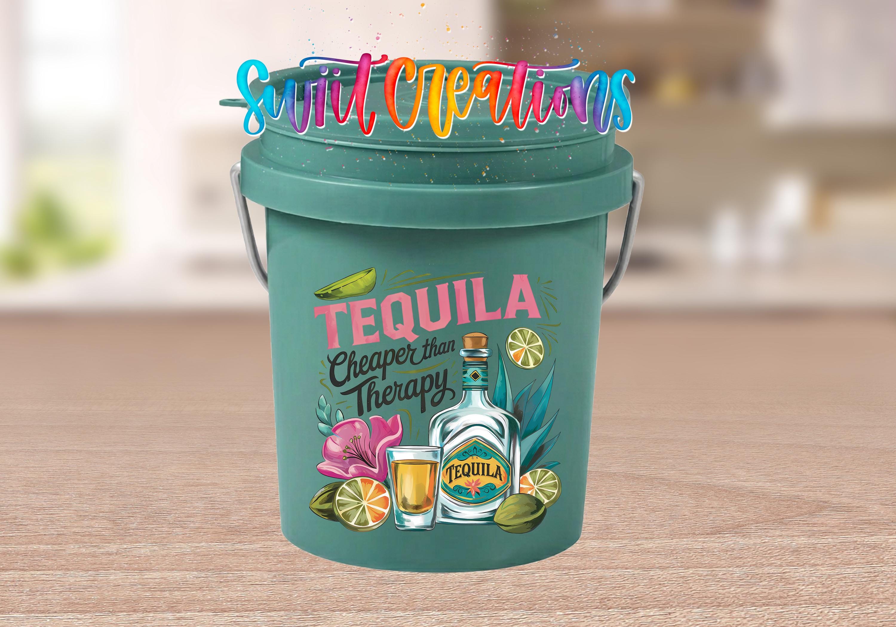 A green bucket with a tequila-themed design, featuring a bottle of tequila, a lime, and other tequila-related items. The bucket also has a colorful text overlay that says "Sweet Creations Tequila Cheaper than Therapy".