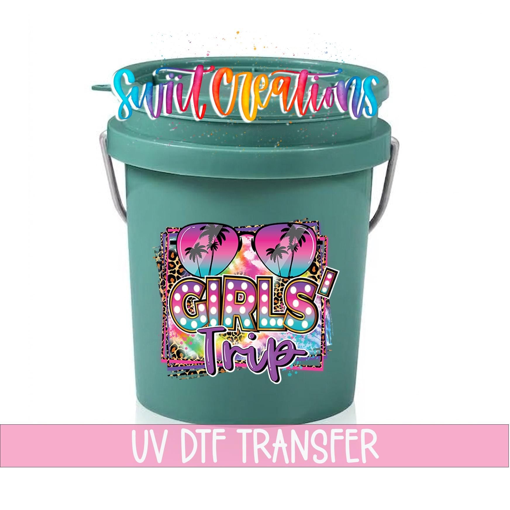 A green bucket with a colorful graphic and text printed on it.