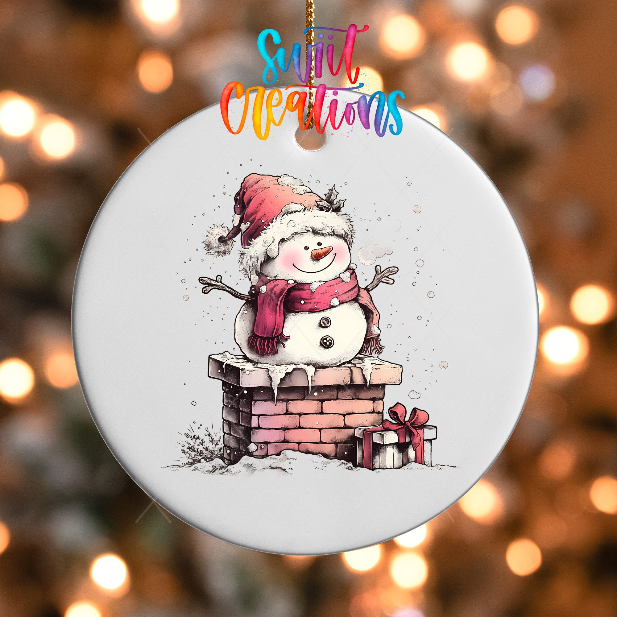 A snowman ornament with a red scarf and hat, standing on a brick chimney, with a gift box and snowflakes falling around it.