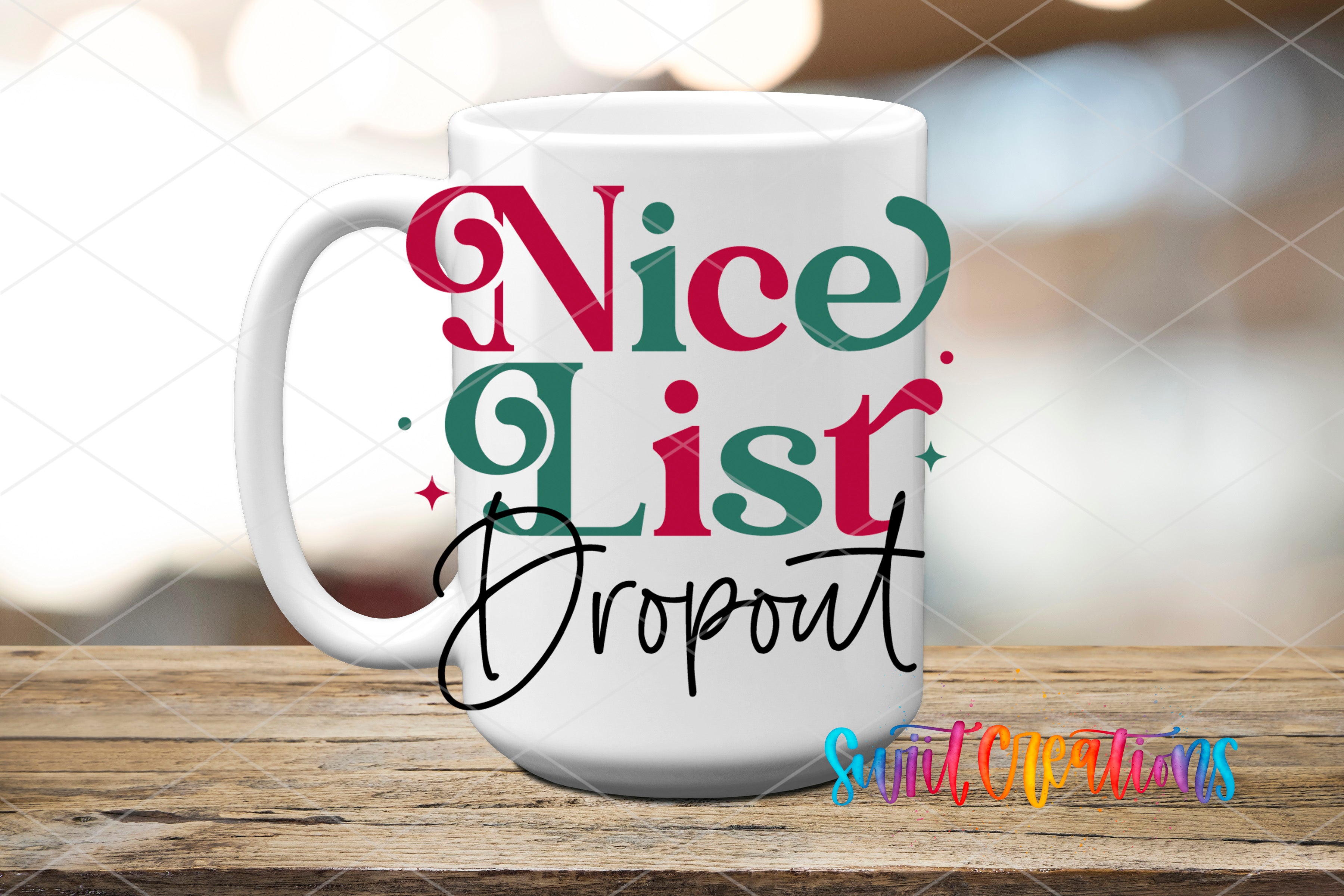 A white mug with the text "nice list dropout" printed on it, sitting on a wooden surface.