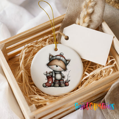 whimsical Christmas cat ceramic Christmas ornament displayed in a wooden gift crate