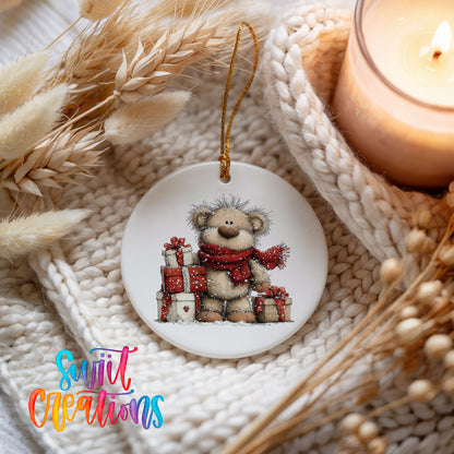 teddy bear with a red scarf and Christmas gifts ceramic Christmas ornament styled on a cozy knit blanket