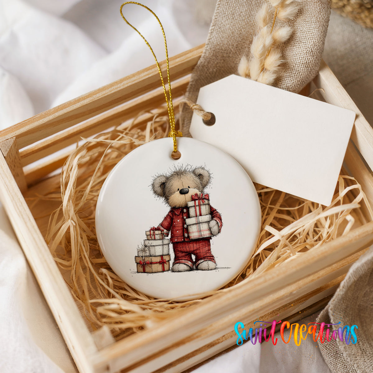 teddy bear carrying a stack of Christmas gifts ceramic Christmas ornament displayed in a wooden gift crate