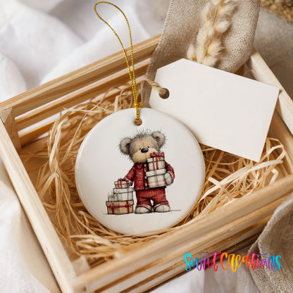 teddy bear carrying a stack of Christmas gifts ceramic Christmas ornament displayed in a wooden gift crate