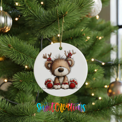 reindeer teddy bear with red Christmas ornaments ceramic Christmas ornament hanging on a lit Christmas tree