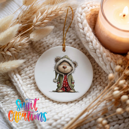 teddy bear in a gray hooded winter coat ceramic Christmas ornament styled on a cozy knit blanket