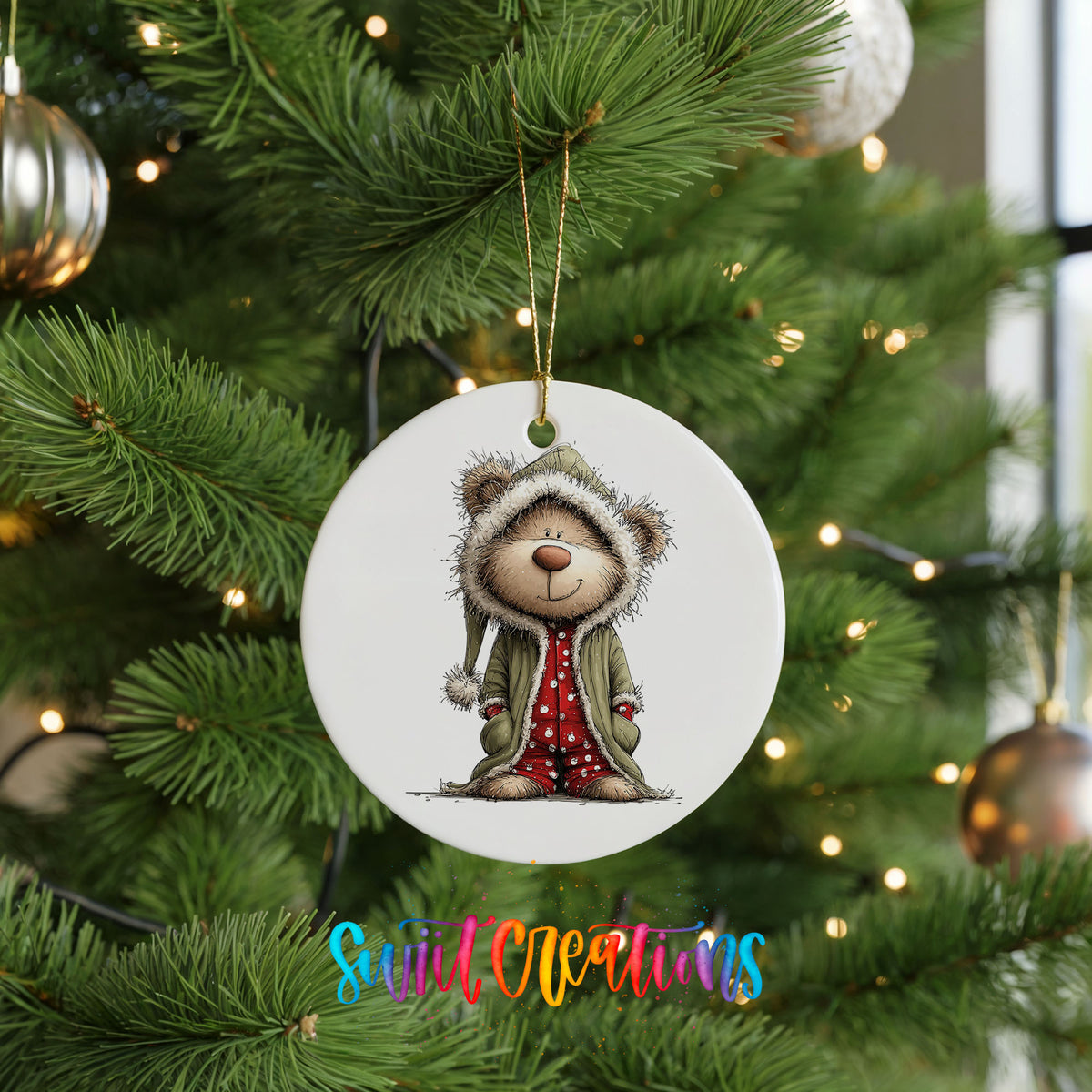 teddy bear in a gray hooded winter coat ceramic Christmas ornament hanging on a lit Christmas tree