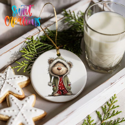teddy bear in a gray hooded winter coat ceramic Christmas ornament styled with holiday cookies and a candle