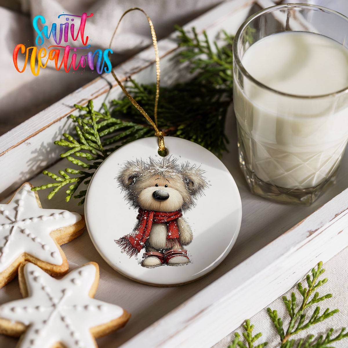 teddy bear in a red scarf standing in the snow ceramic Christmas ornament styled with holiday cookies and a candle