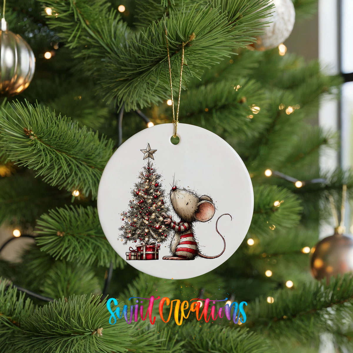 woodland mouse beside a decorated Christmas tree ceramic Christmas ornament hanging on a lit Christmas tree