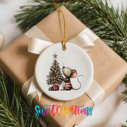 woodland mouse beside a decorated Christmas tree ceramic Christmas ornament displayed on a wrapped Christmas gift