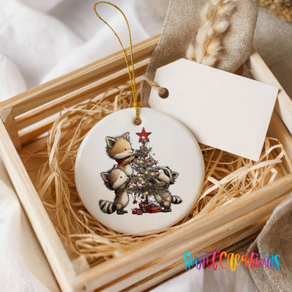 woodland fox beside a decorated Christmas tree ceramic Christmas ornament displayed in a wooden gift crate