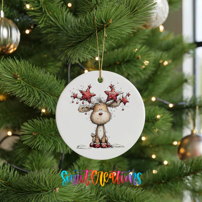 woodland reindeer with red stars on its antlers ceramic Christmas ornament hanging on a lit Christmas tree