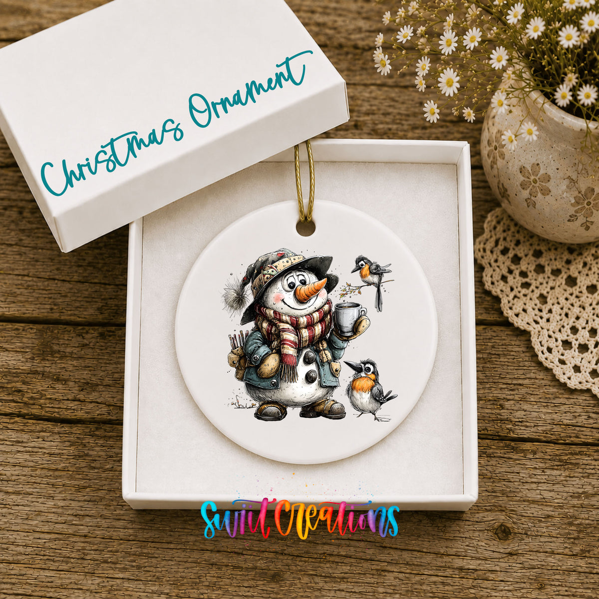snowman with winter birds and a warm mug ceramic Christmas ornament presented in a gift box