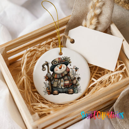 snowman sitting with woodland animals ceramic Christmas ornament displayed in a wooden gift crate