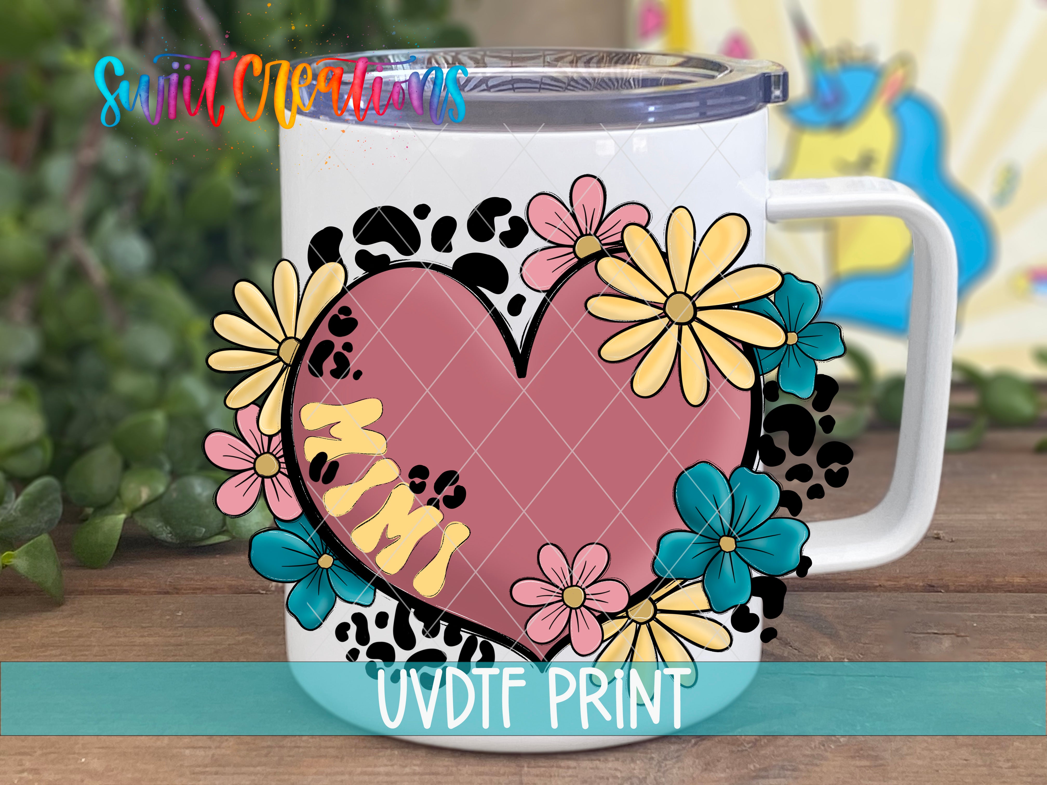 A white mug with a colorful floral design and a heart shape, featuring the word "Mimi" written on it.