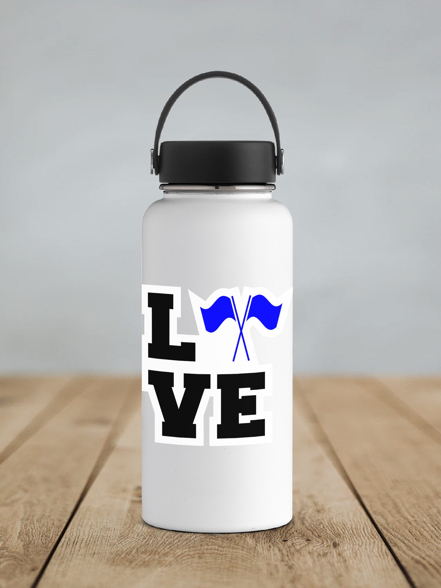 a white water bottle sitting on top of a wooden table