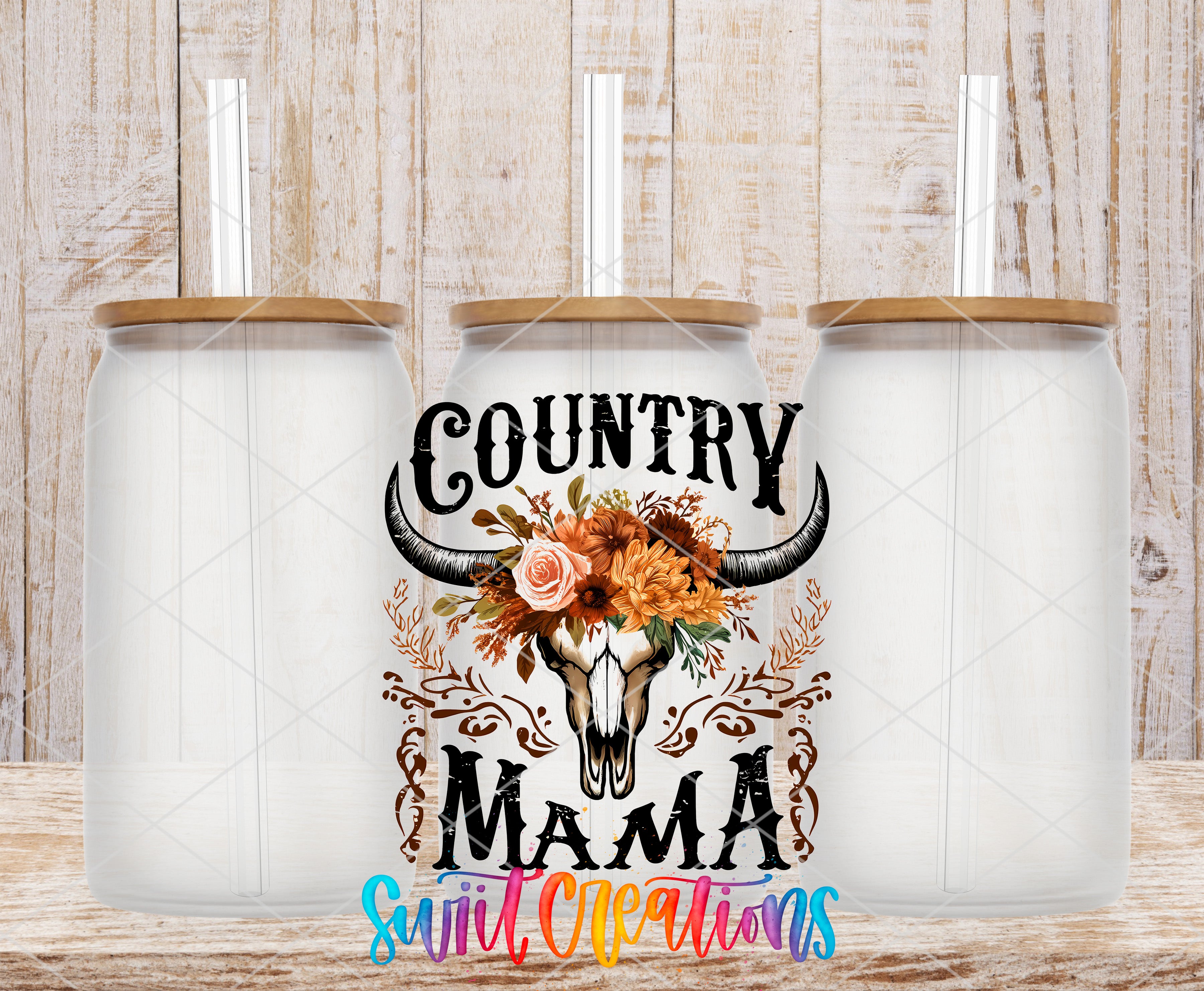 three glass jars with lids, each containing a straw. The jars are arranged in a row, and there is a decorative design on the front of the jars that includes a skull and floral elements. The text "Country Mama" is displayed prominently in the center of the jars, and the phrase "Swift Creations" is written below the jars.