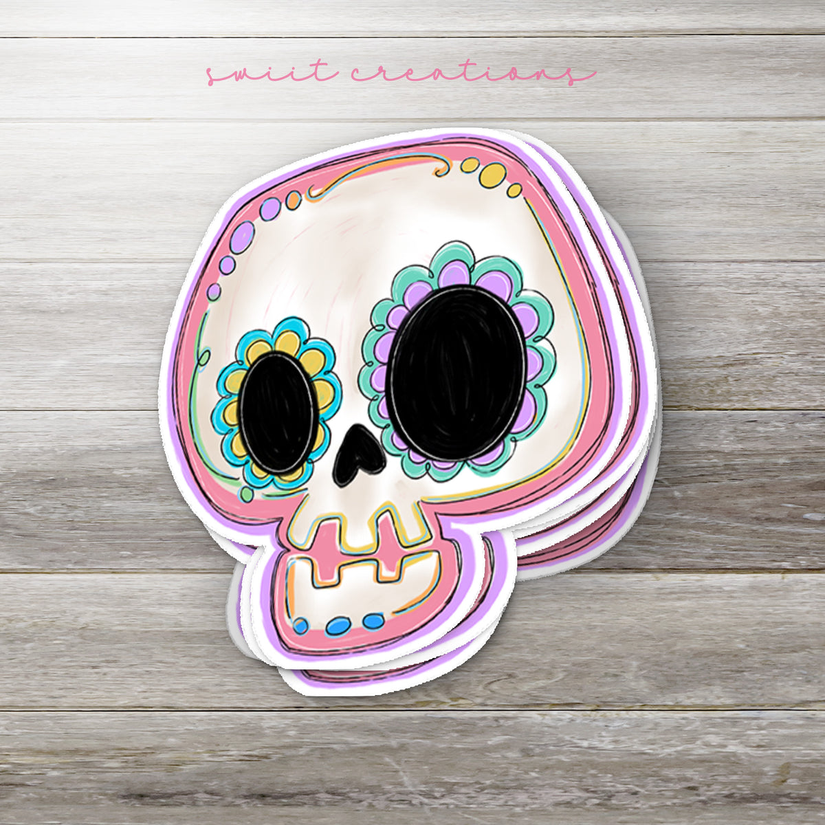 a paper cutout of a sugar skull