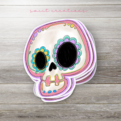 a paper cutout of a sugar skull