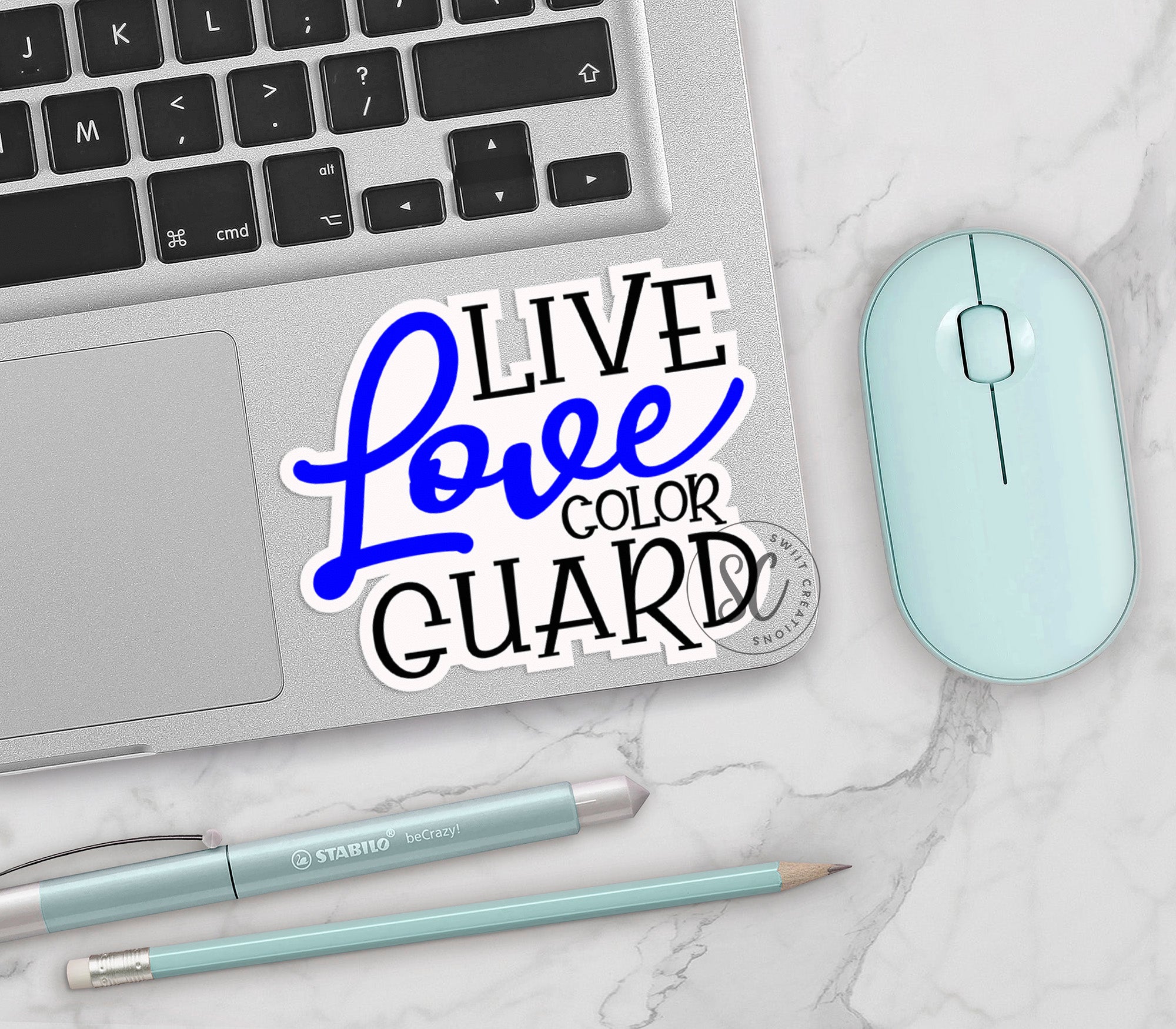 a laptop computer sitting on top of a white table