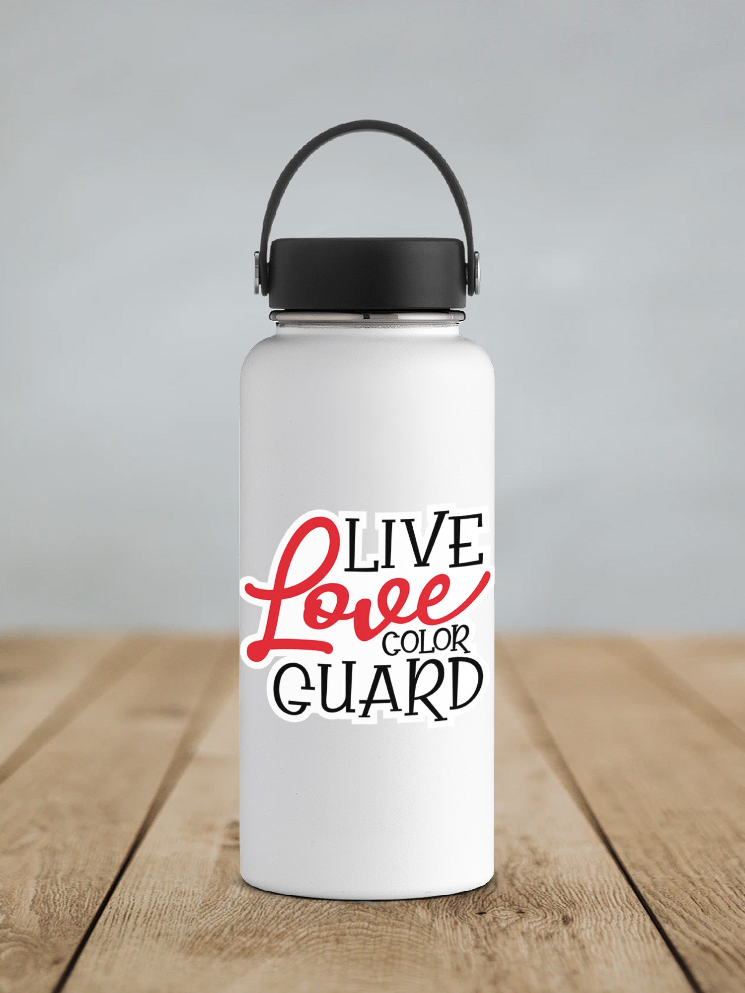 a white water bottle sitting on top of a wooden table