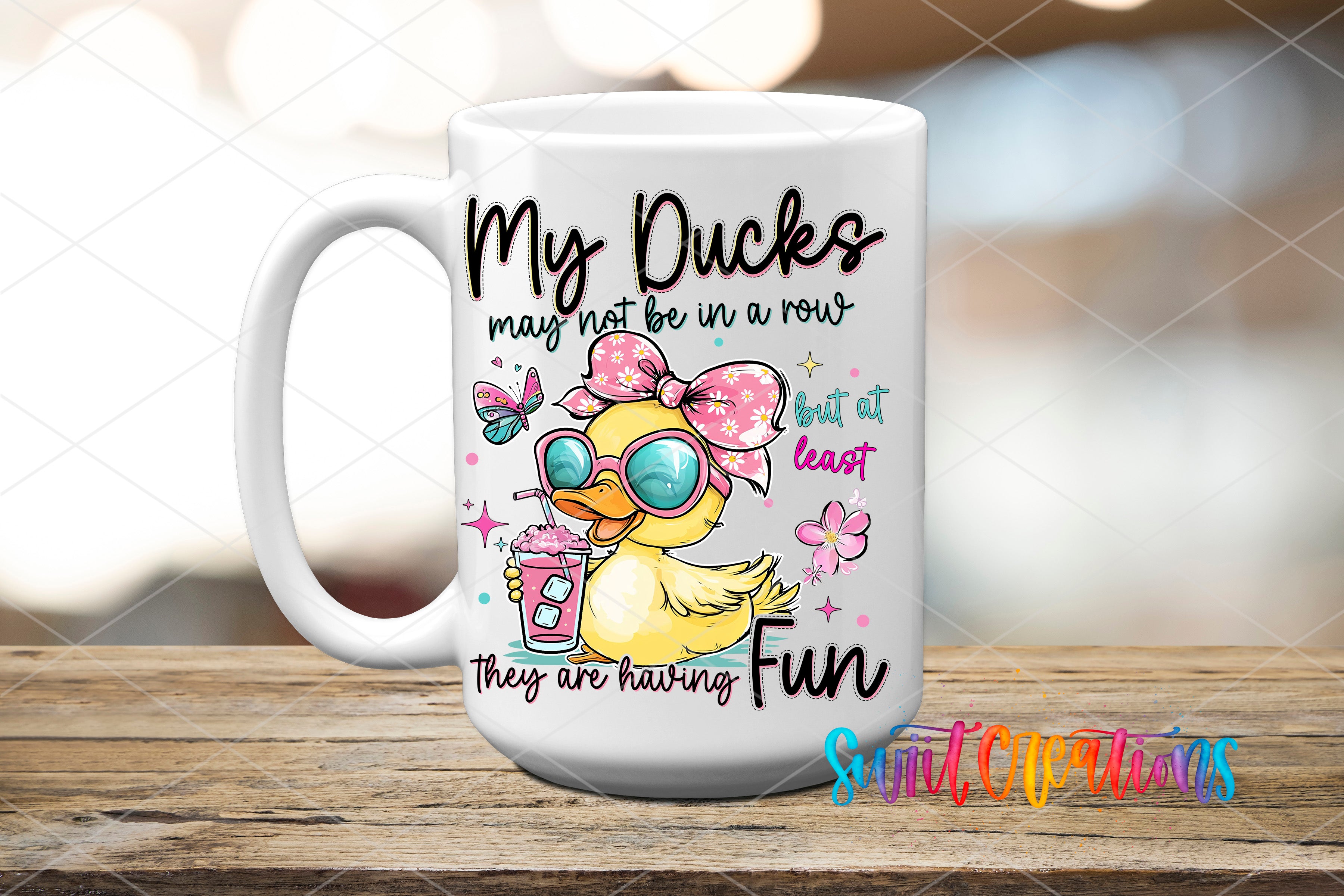 A white ceramic mug with a cartoon duck and text printed on it.