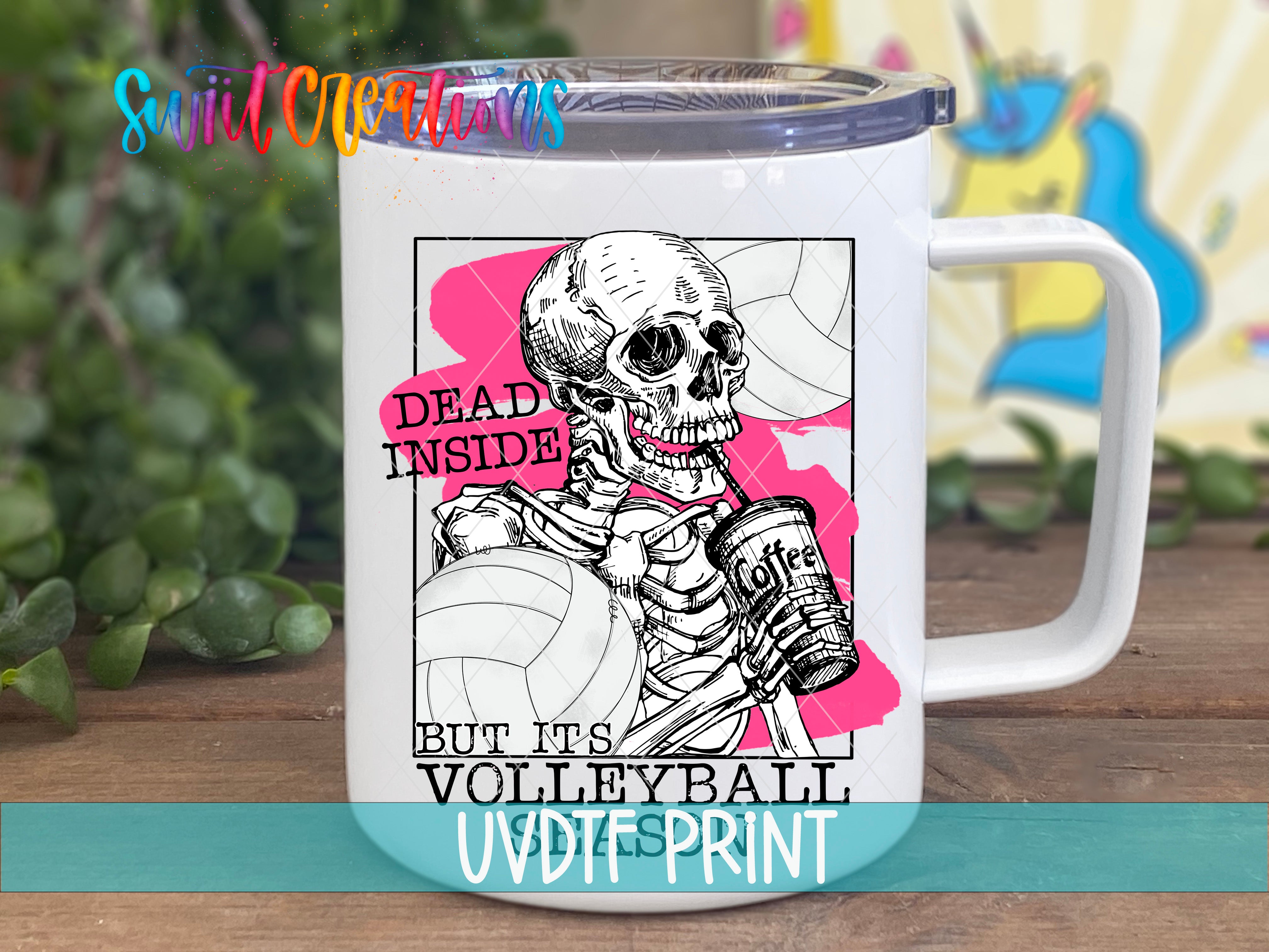 A white mug with a graphic design featuring a skeleton holding a volleyball and the text "Dead inside but its volleyball" printed on it.