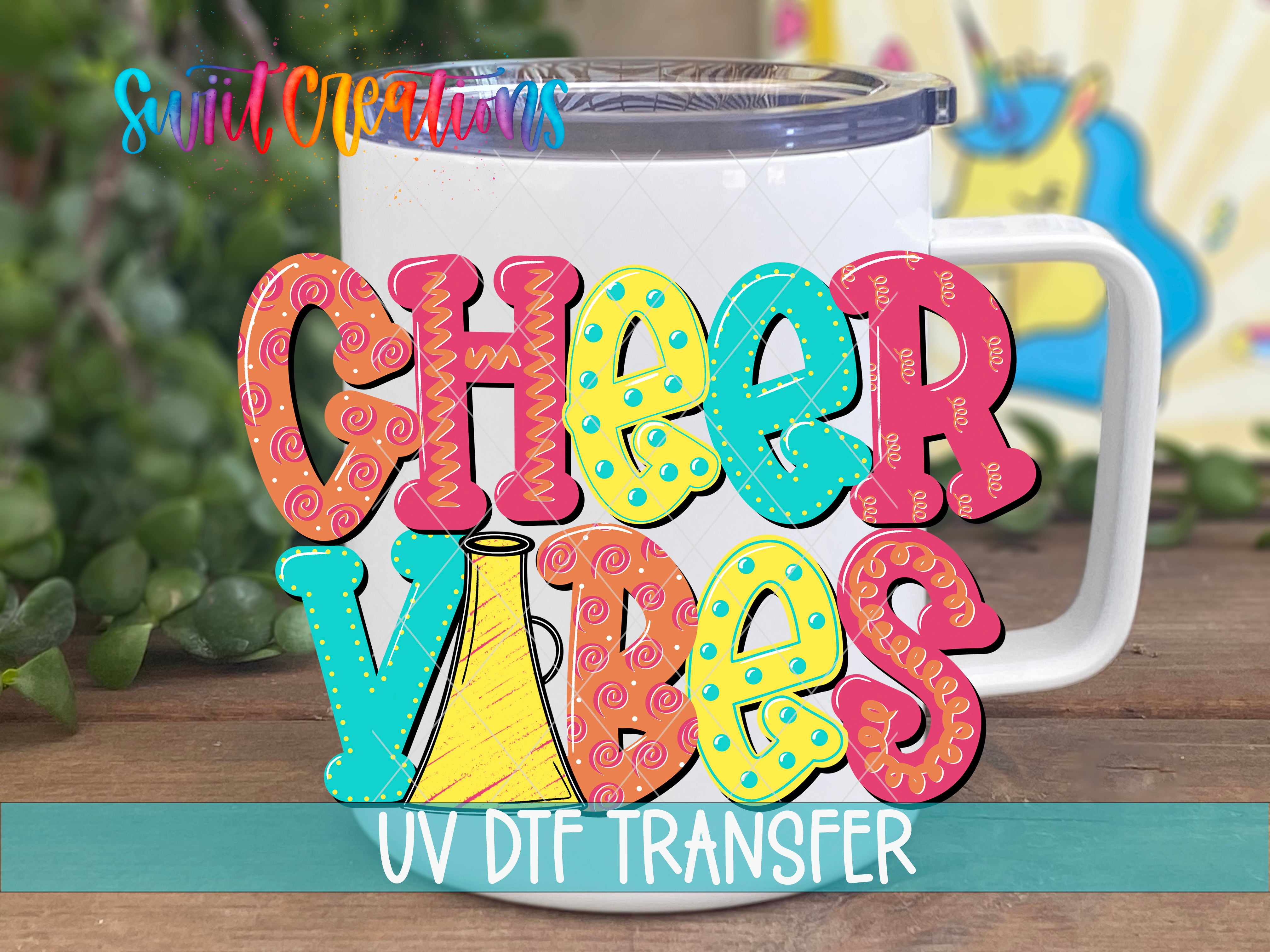 A colorful mug with the text "CHEER VIBES" printed on it, along with a UV DFT Transfer logo.