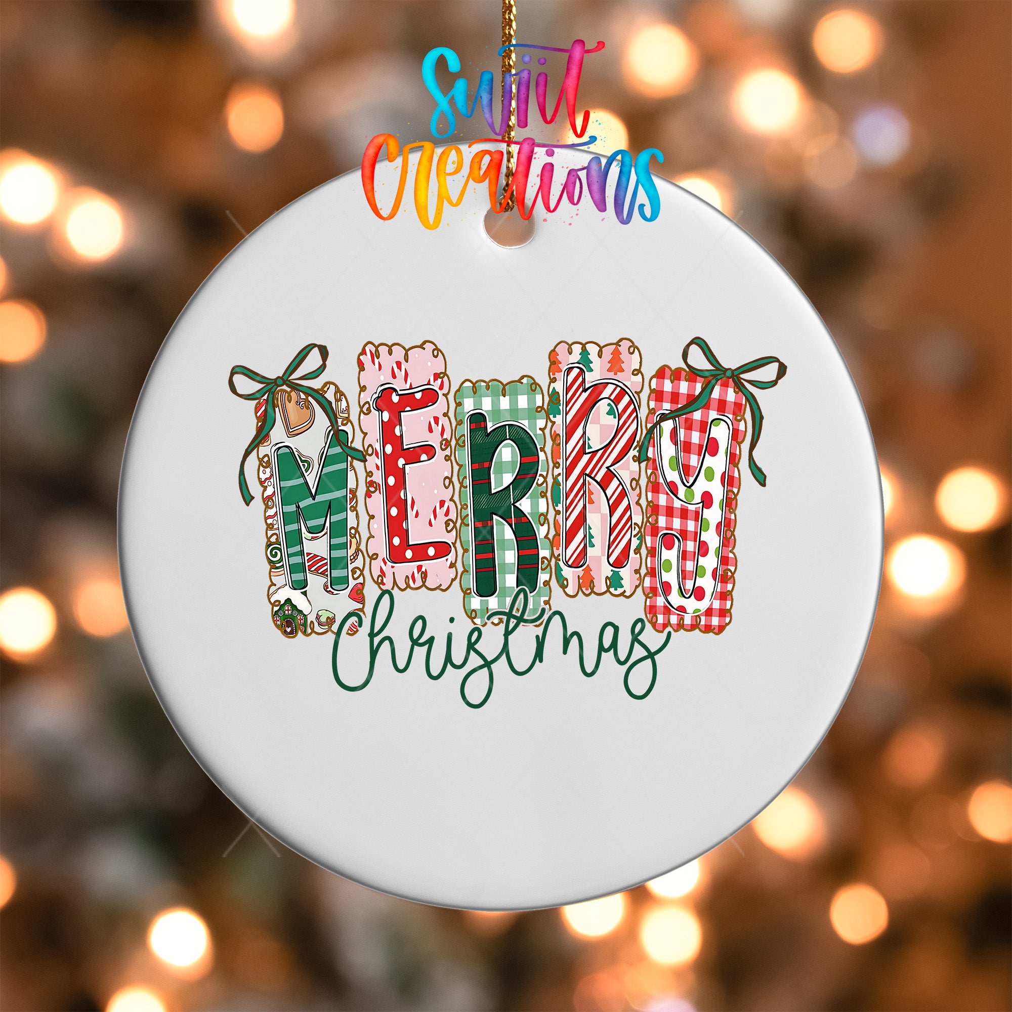 A white ornament with the word "MERRY" spelled out in colorful letters hanging from a string.