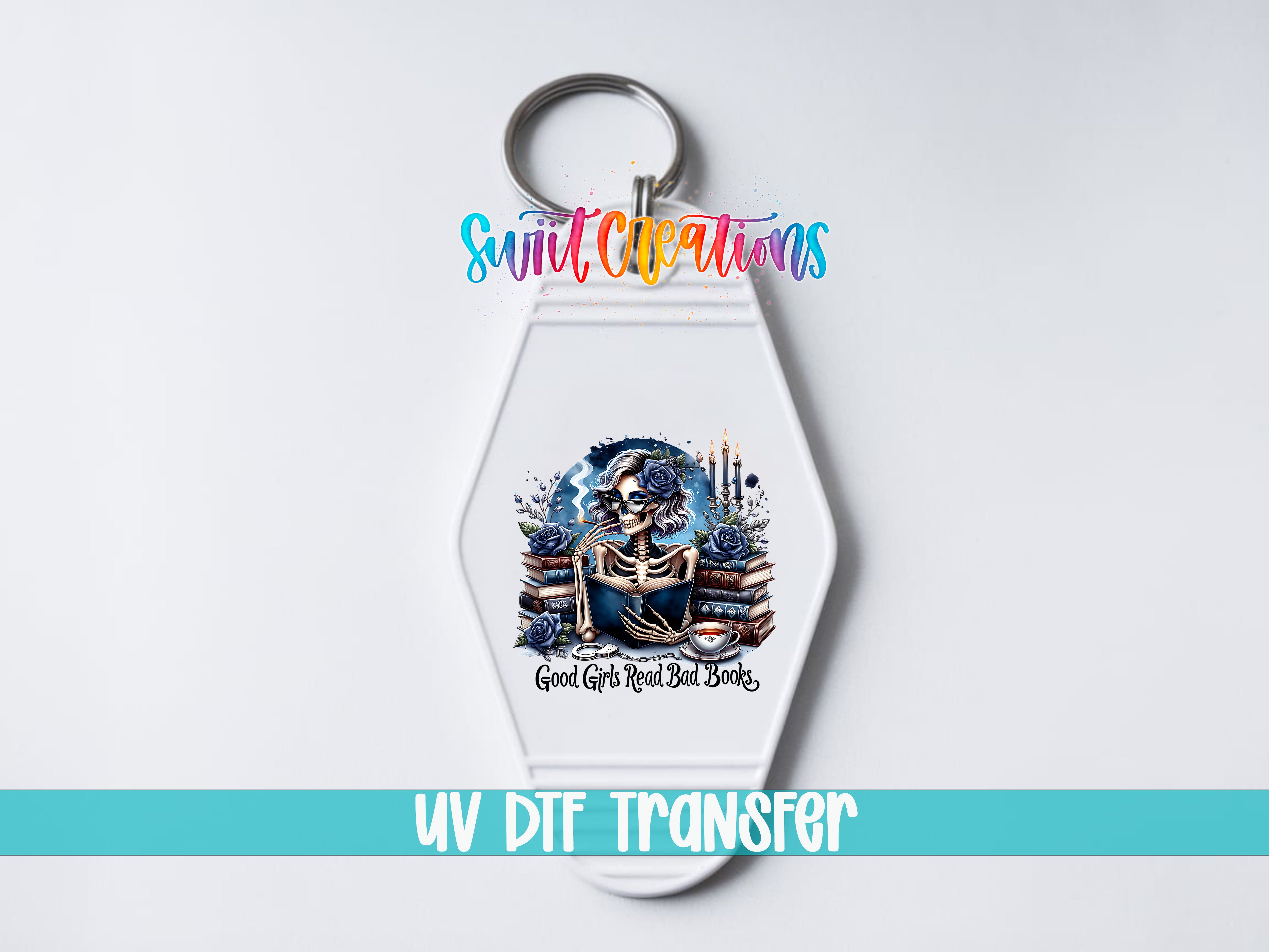A keychain with a colorful design featuring a skeleton, flowers, and books, along with the text "Good Girls Read Bad Books" and "UV DIF TRANSFER".