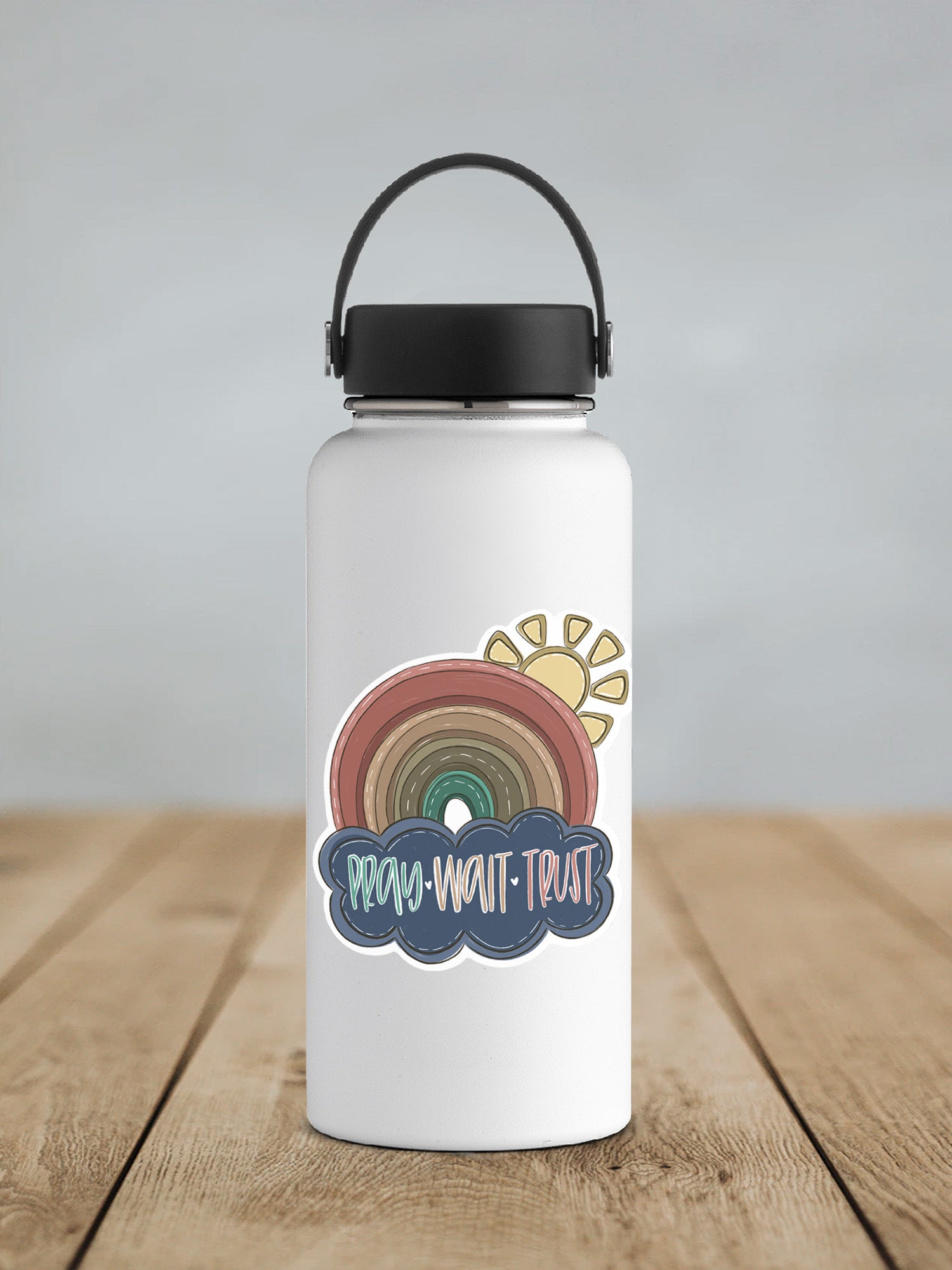 a water bottle sitting on top of a wooden table