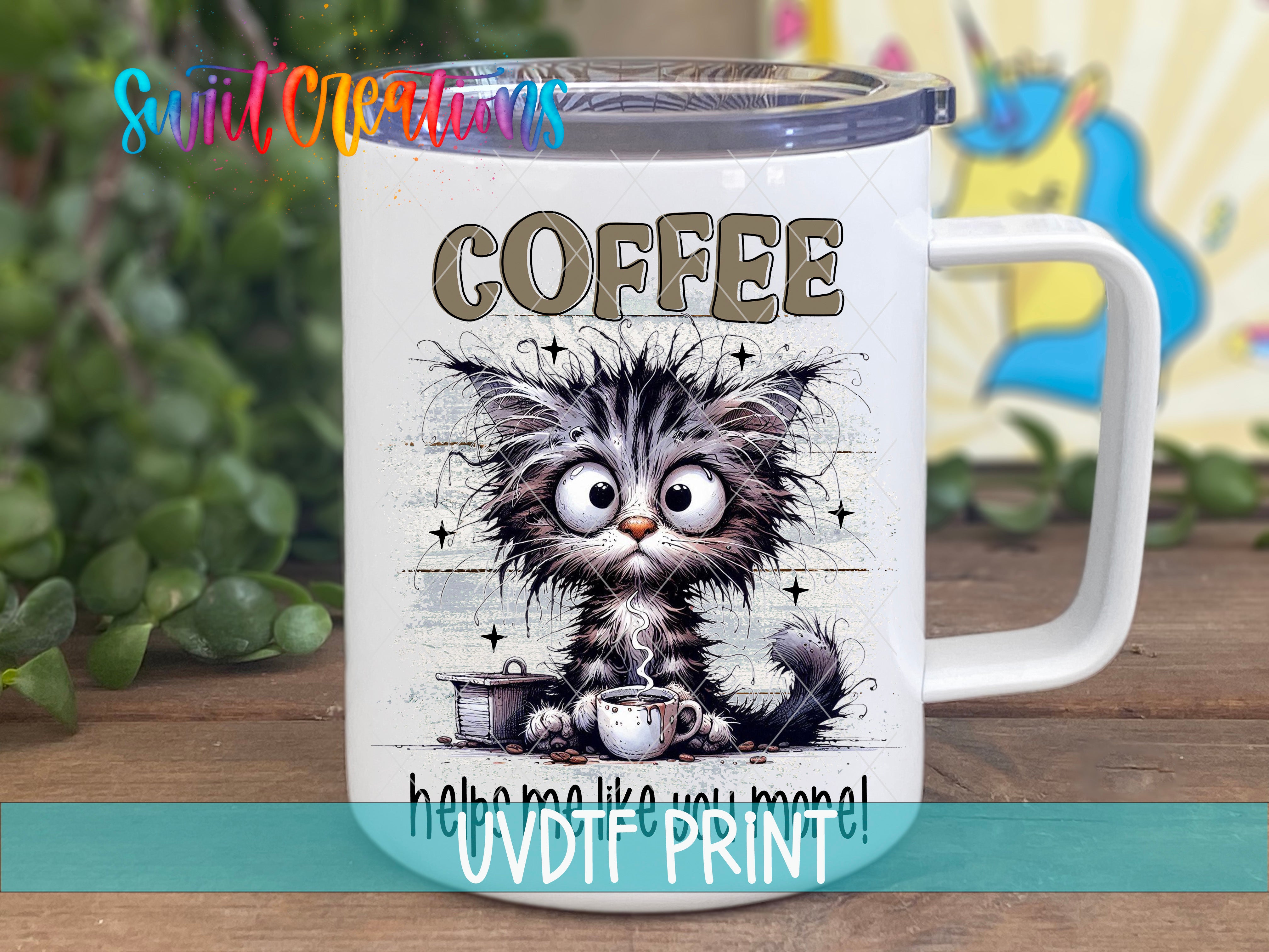 A white mug with a cartoon cat design and the word "COFFEE" printed on it.