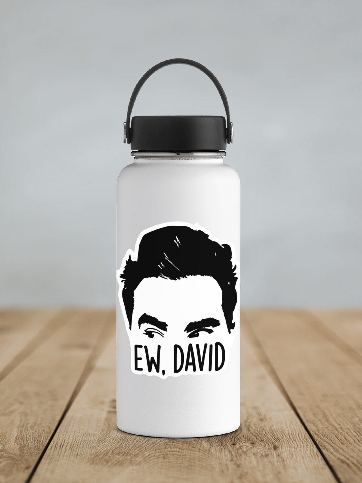 a water bottle with a picture of a man's face on it