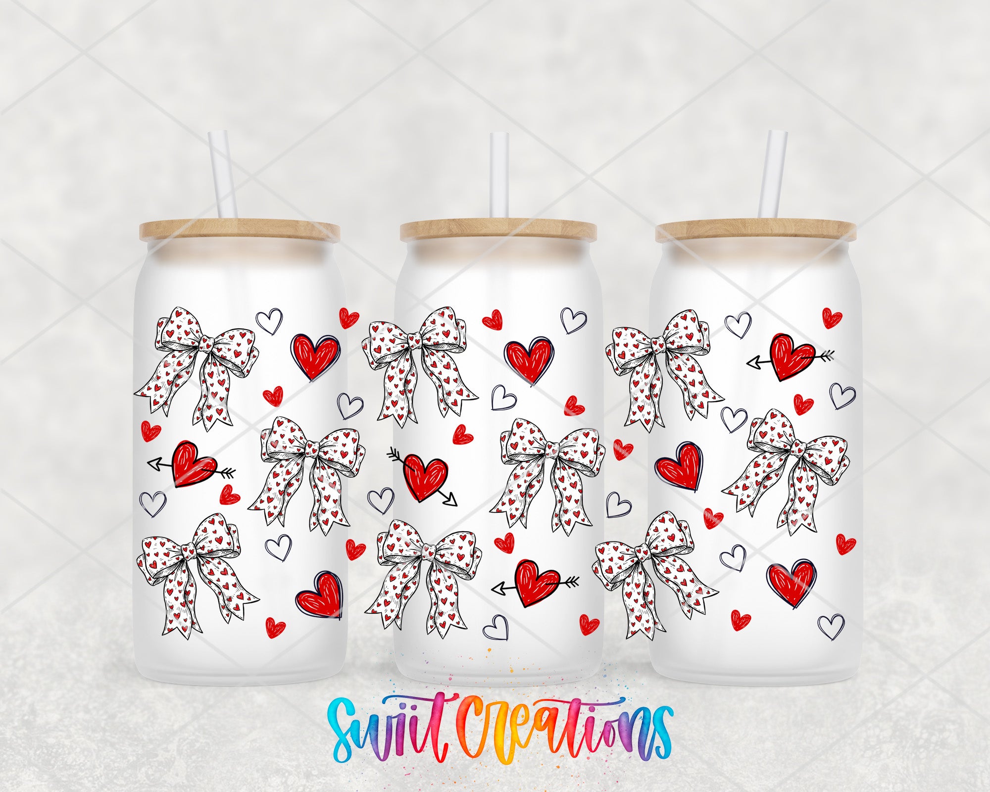 three white tumblers with bows and hearts printed on them.