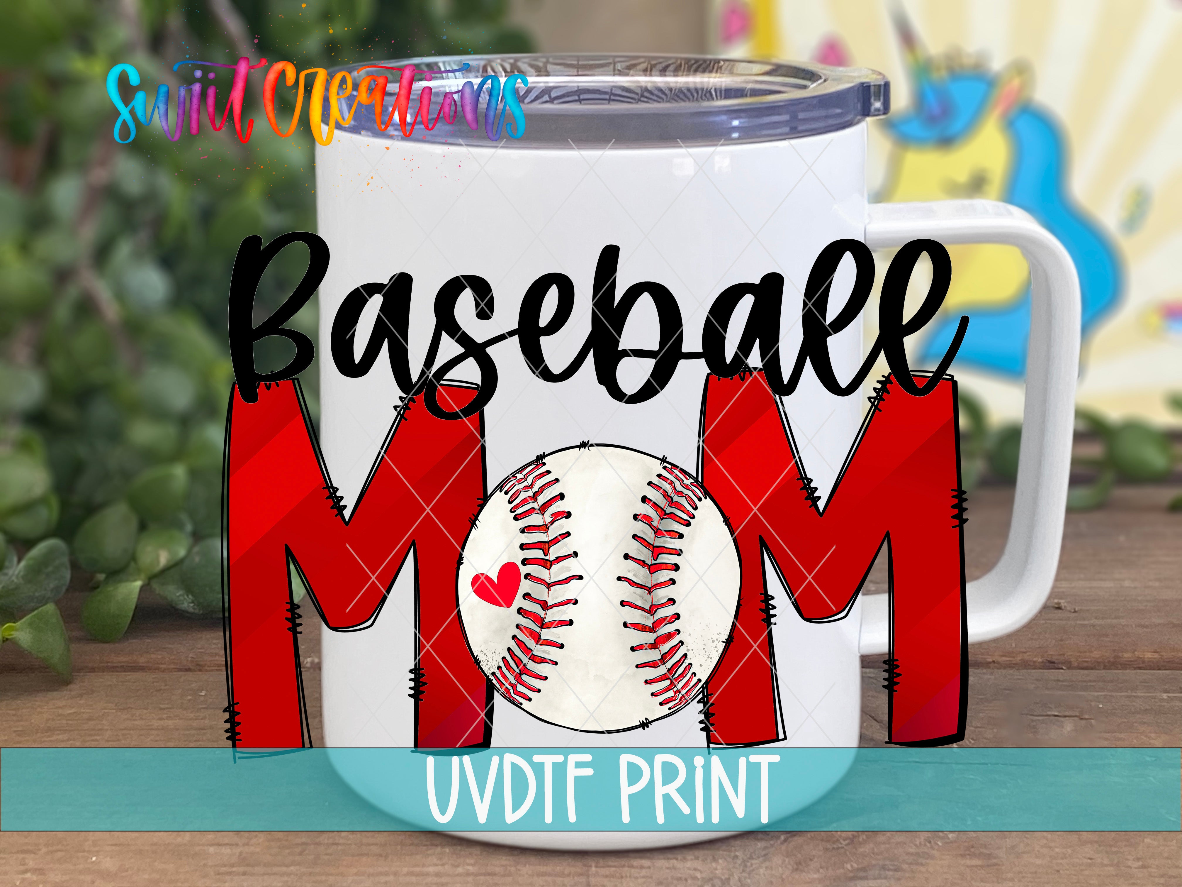 A white mug with the text "Baseball Mom" and a baseball graphic printed on it, placed on a wooden surface with a blurred background.