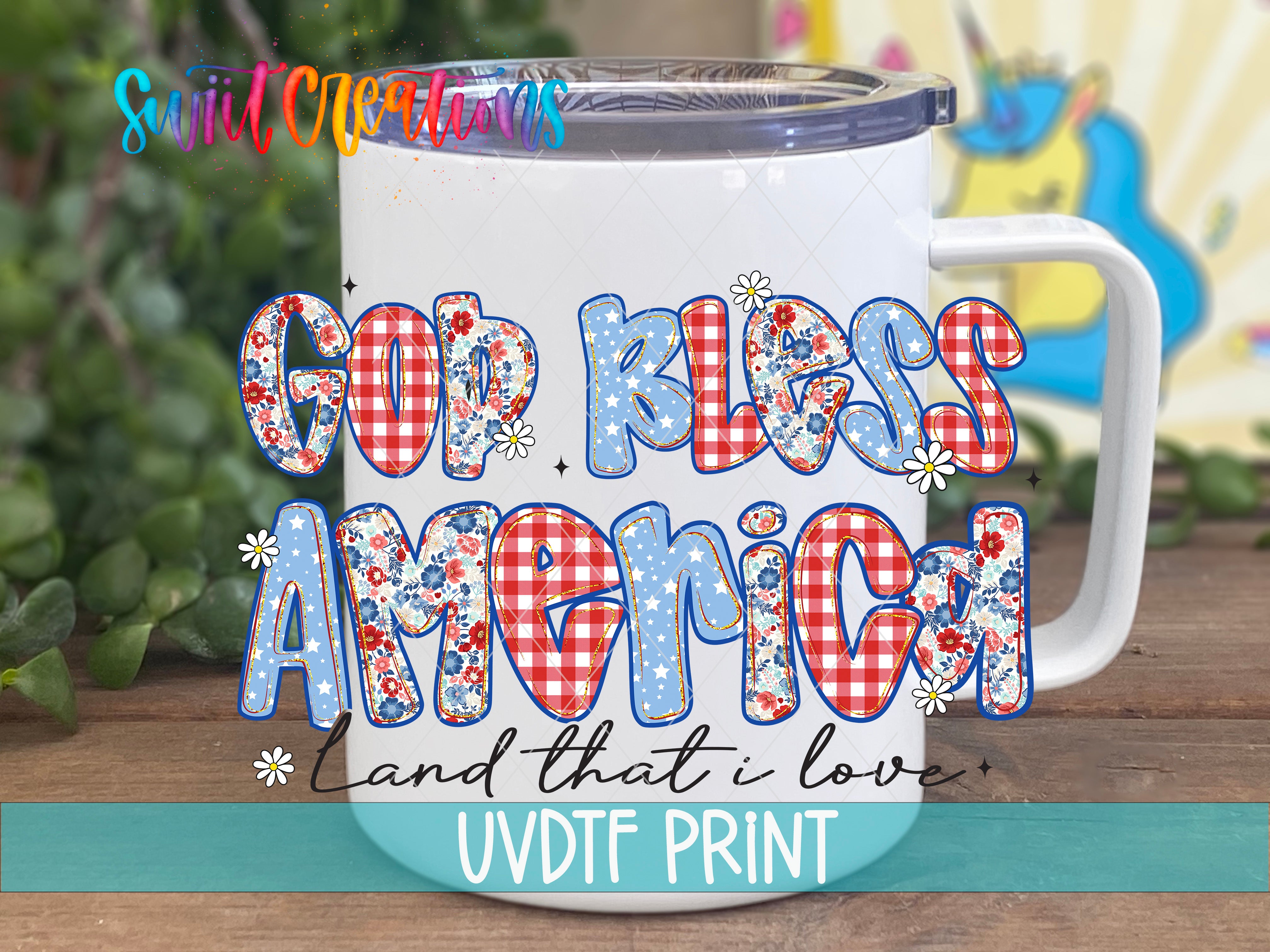 A white mug with colorful floral designs and text on it, placed on a wooden surface.