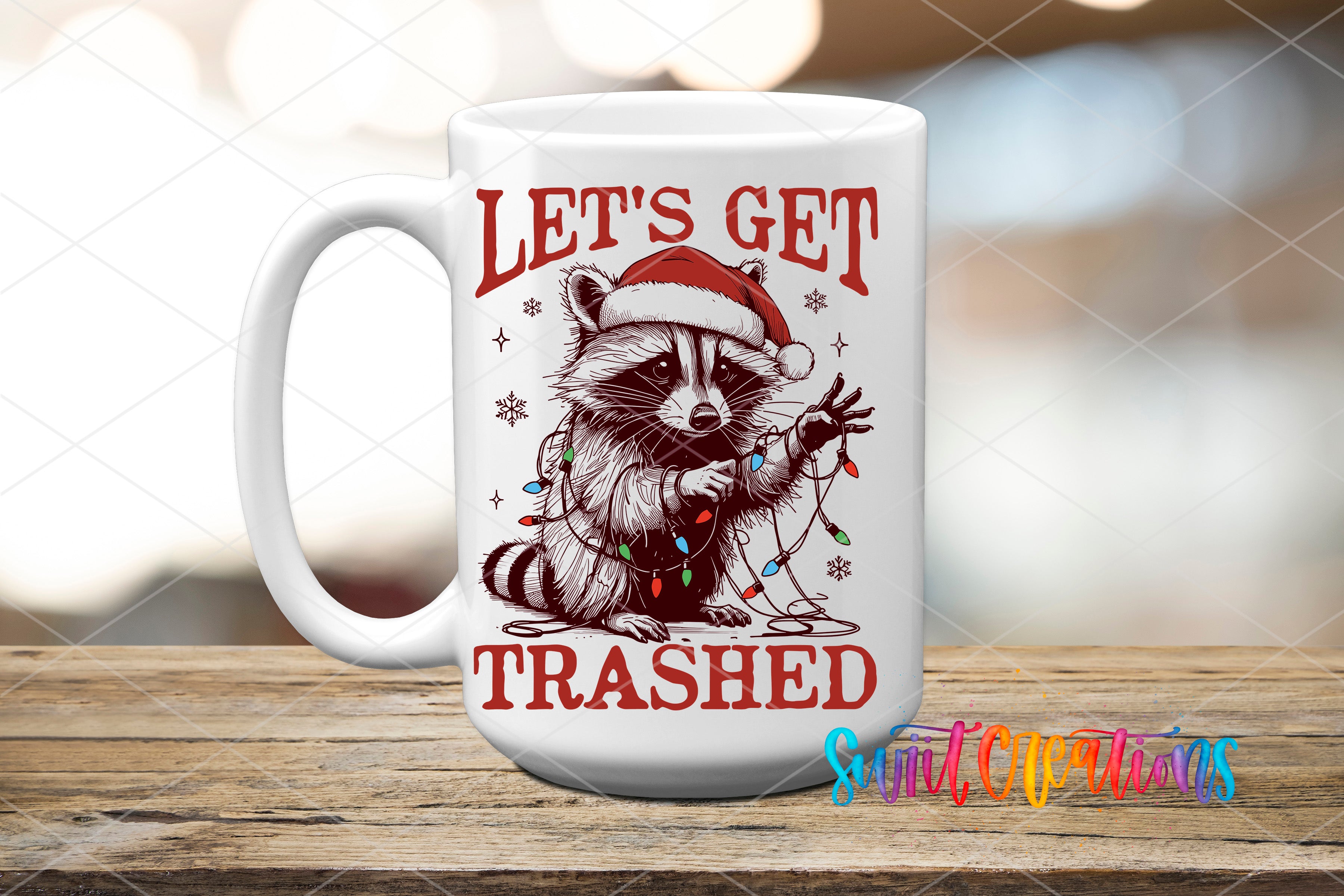 A white mug with a graphic design featuring a raccoon wearing a Santa hat and holding a Christmas ornament, along with the text "Let's get trashhed".