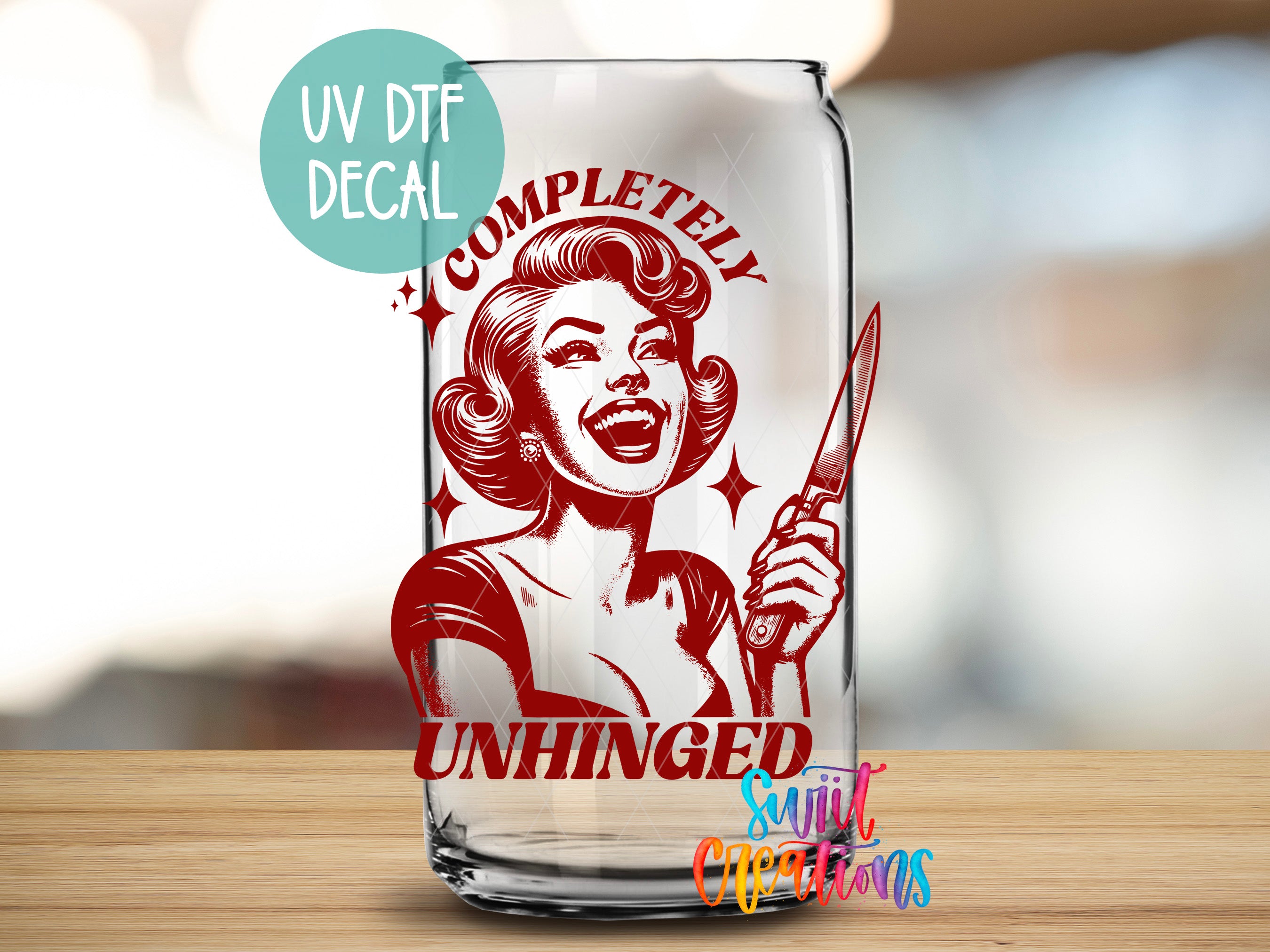 a glass with a picture of a woman holding a knife