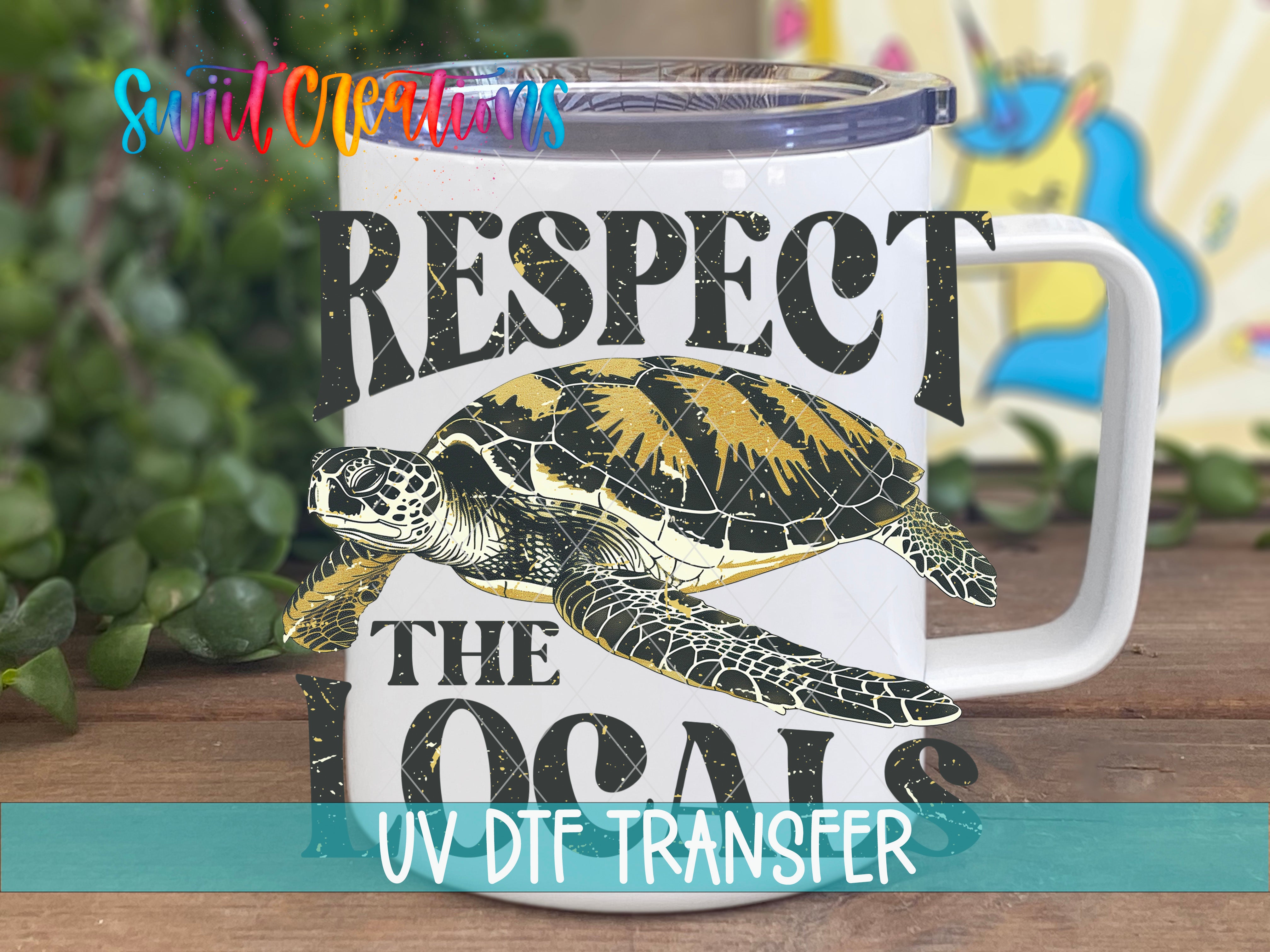 A white mug with a printed design featuring a turtle and the text "RESPECT THE LOCALS" printed on it.
